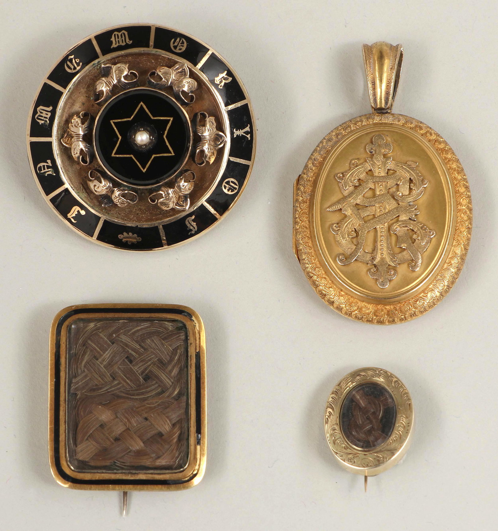 Group of (4) gold mourning jewelry: Group of (4) gold mourning jewelry, to include: 14k gold pendant converted to a pin, front with border reading ''IN MEMORY OF'', gold leaves in relief and a central pearl accent, back with hair inside