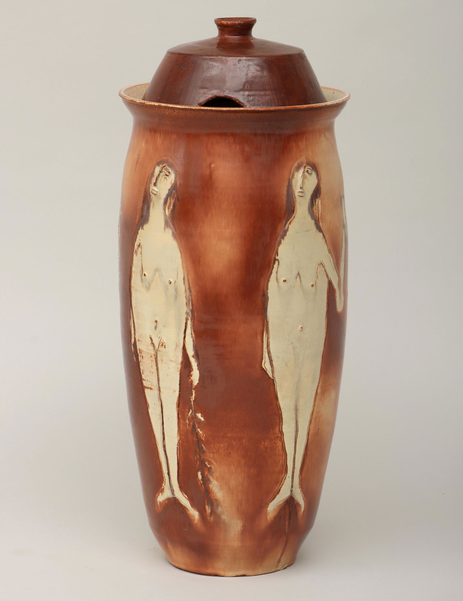 BROTHER THOMAS BEZANSON: BROTHER THOMAS BEZANSON (Canadian-American, 1929-2007), tall covered jar decorated with female nudes, 1958, glazed earthenware, signed ''Bezanson'', dated, and inscribed ''AMDG'' (Ad Melor Dei Gloria)