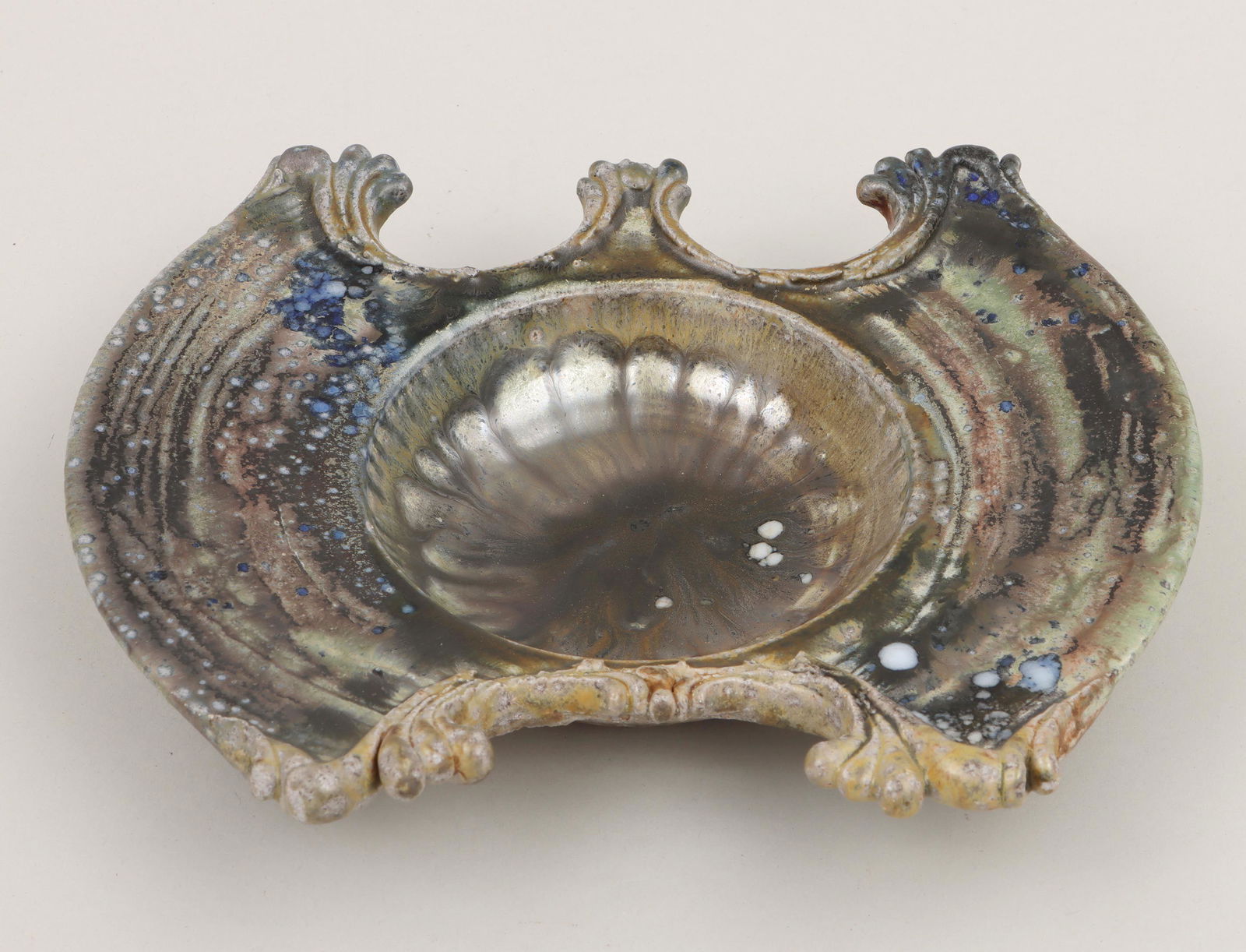 DON REITZ: DON REITZ (American, 1929-2014), wide wing-shaped dish, glazed stoneware, signed ''Reitz'' and initialed to underside. Minor wear to glaze at edges, minor areas of crazing. 9-3/4''w, 8-1/2''d, 1-3/4''