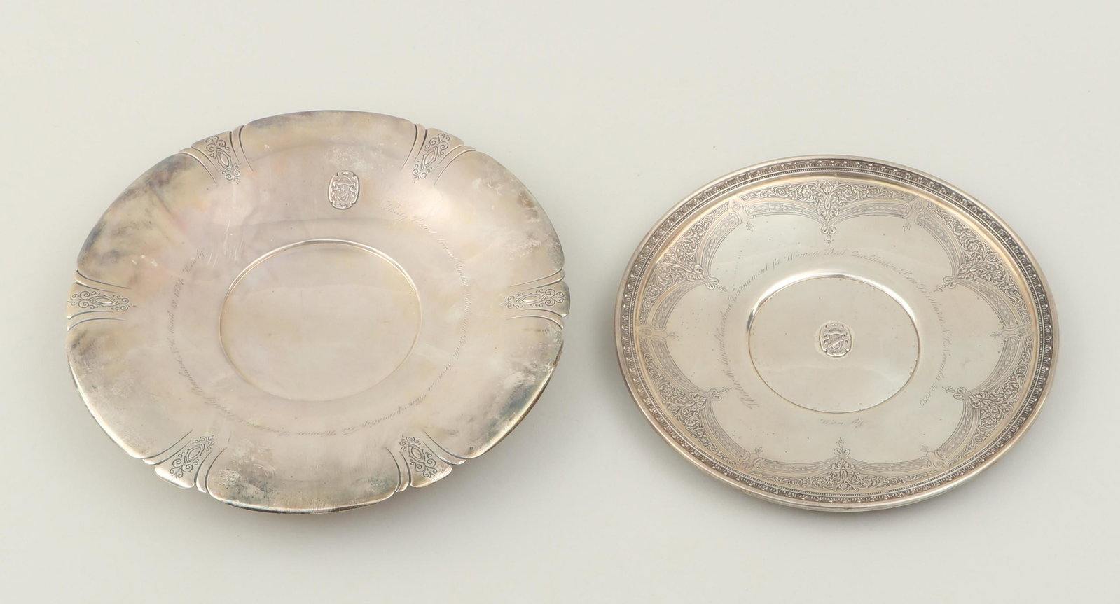Pinehurst Golf Club awards: Group of (2) sterling silver Pinehurst Golf Club awards, with applied ''Pinehurst Golf Club'' crests and chased and repousse designs, Towle Manufacturing Co., Newburyport, MA, 1930s, to include: charg
