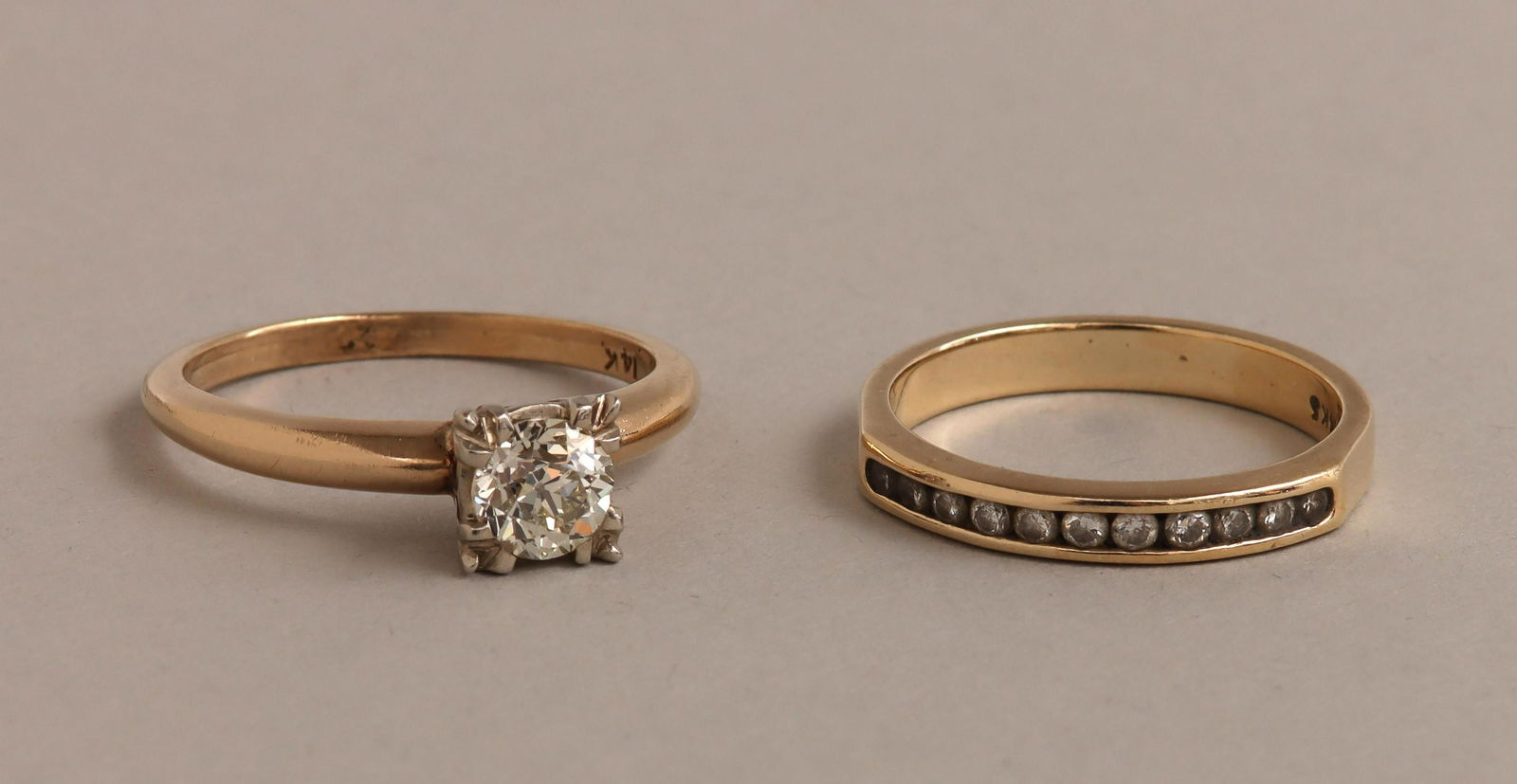 Two-piece diamond 14k ring set: Two-piece diamond and 14k gold engagement ring set, to include: solitaire ring, having a European-cut diamond (SI2, K color, chips) with open culet, approximately 0.6 carats, set in prongs with foliat