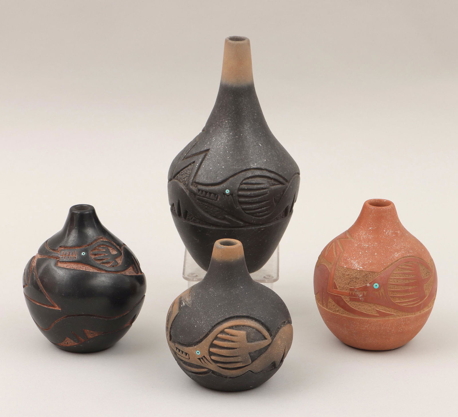 TSE-PE GONZALES: TSE-PE GONZALES (San Ildefonso Pueblo, 1940-2000), group of (4) sgraffito-carved seed jars, having Avanyu with turquoise beads for eyes, 1997, to include: (2) micaceous black and sienna jars, one with