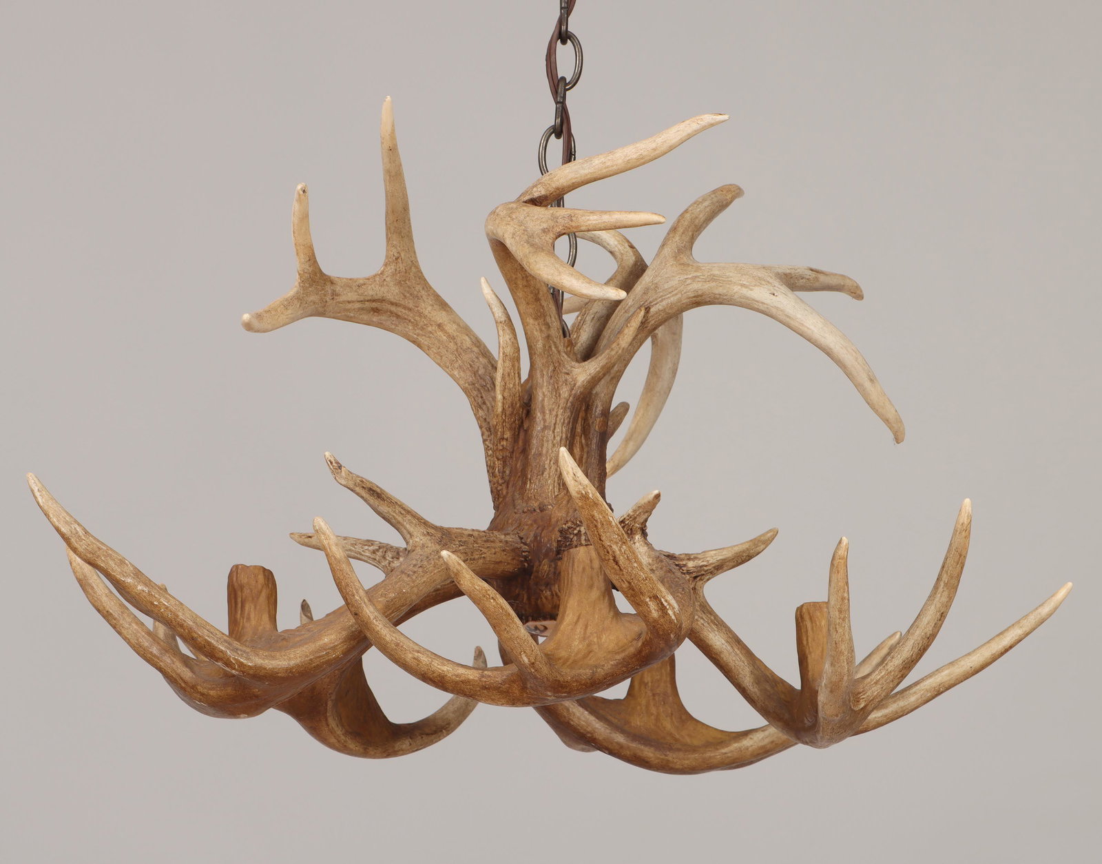 Five-light deer antler chandelier: Five-light deer antler ''Sanctuary'' chandelier, by Wild Designs, with stag painting initialed ''A'' on bottom, signed by monogram, dated, and numbered to side of one antler. Natural wear to antlers. 