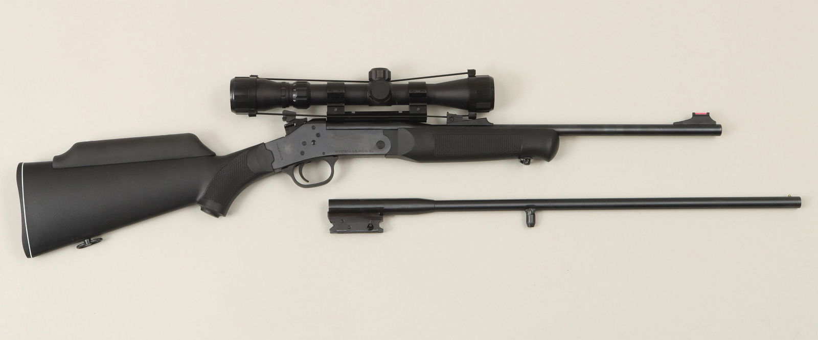 Rossi Trail Boss single shot: Rossi Trail Boss single shot matched pair with separate rifle and shotgun barrels. The 22 LR barrel measures 18-1/2'' with a Famous Maker 3x9 scope and open sights. The 410 3'' barrel measures 21-7/8'