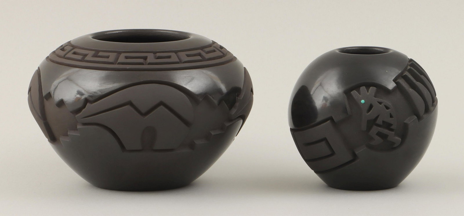 HARRISON BEGAY JR.: HARRISON BEGAY JR. (Navajo and Santa Clara Pueblo, b. 1961), group of (2) carved blackware jars, to include: jar having bears with heartlines, 1996; and seed jar, having band of micaceous clay with fe