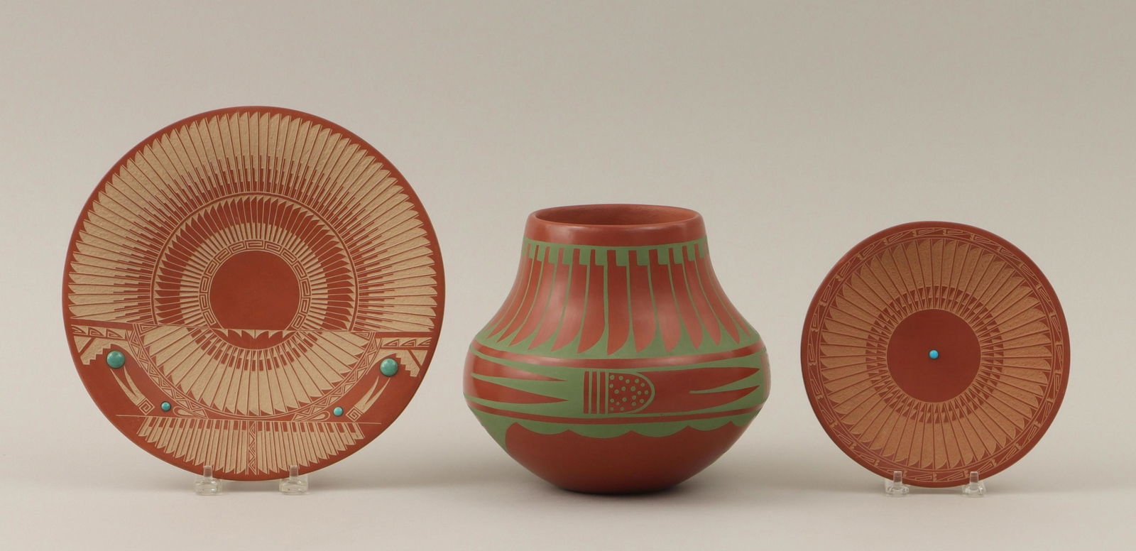 Group of (3) San Ildefonso pottery: Group of (3) San Ildefonso pottery with feathers and geometric designs, to include: (2) sgraffito-carved redware plates by MARIE GONZALES-KAILAHI (1922-1995), comprising large plate with (4) turquoise