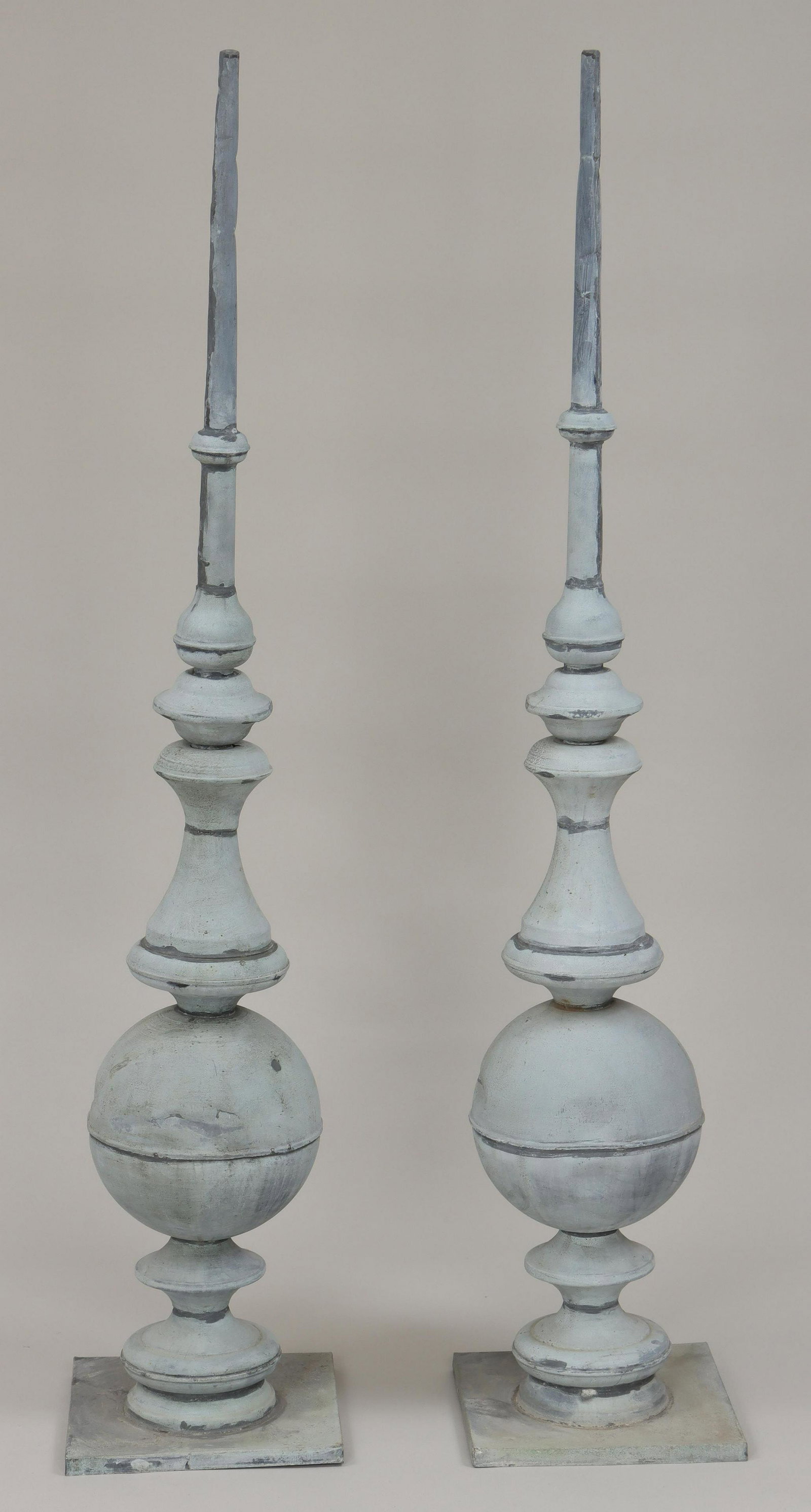 Pair of large zinc finials: Pair of large zinc finials. Dents, separation at one joint with splits. 60''h. IMPORTANT SHIPPING INFORMATION 1 - LIVE-SHIPPING : The service is provided by Liveauctioneers. This option is automatical