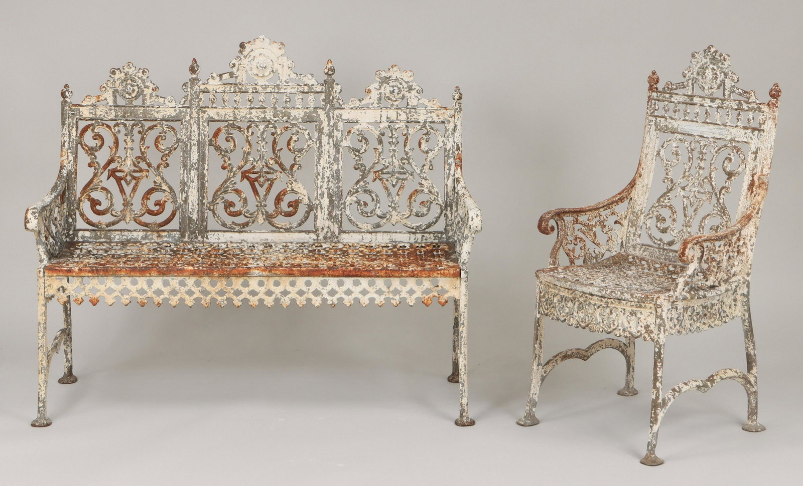 19C two-piece assembled cast iron set: 19th century two-piece assembled cast iron set in ''Curtain'' pattern, to include: settee; and Lister and Fee, Brooklyn, N.Y., armchair. Paint loss, weld repairs at armrest joints. Settee 38''h, 46''w
