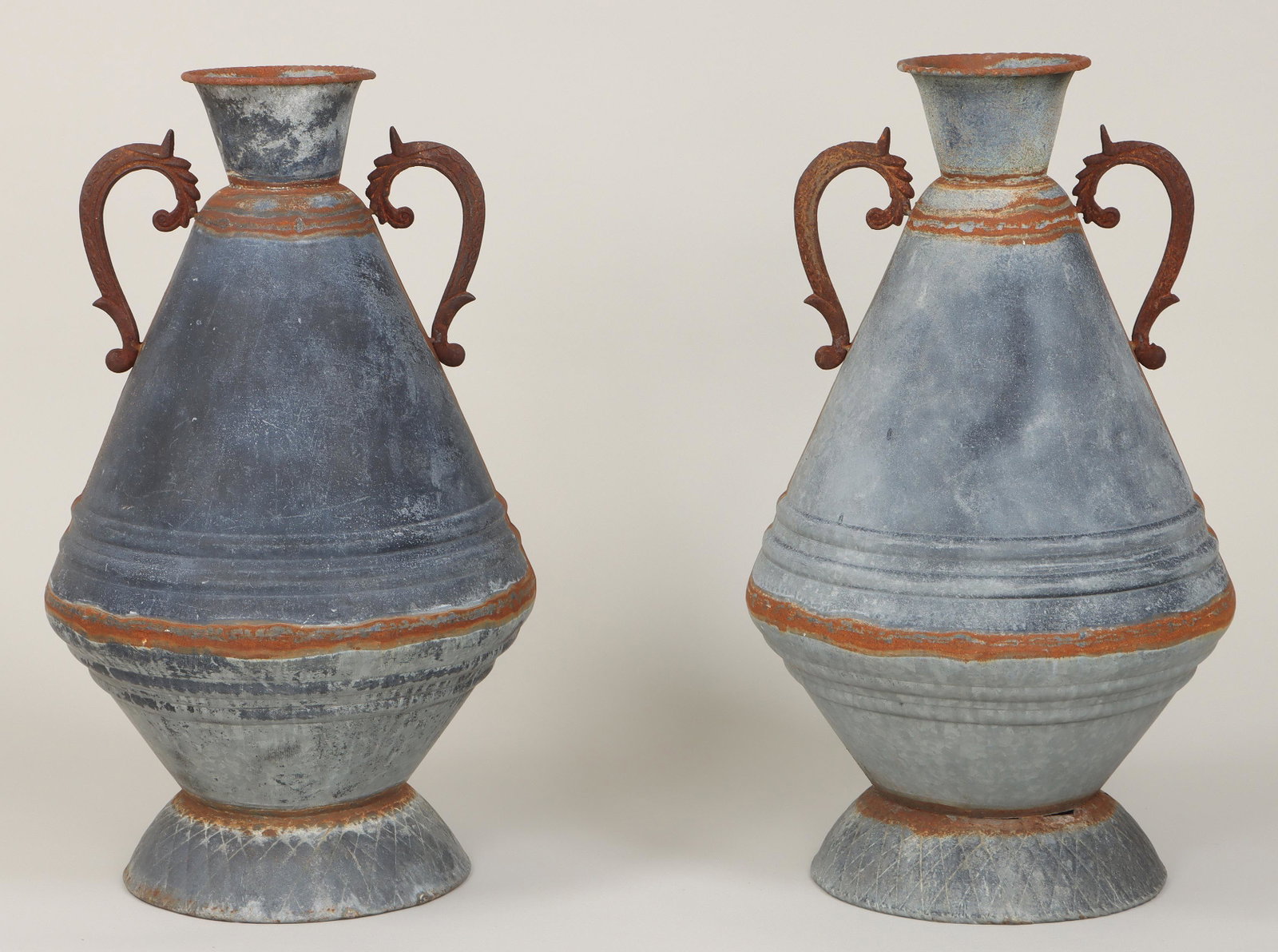 Pair of large two-handled tin vessels: Pair of large two-handled tin vessels. One with seam separation to bottom, minor dents. 33-1/2''h. IMPORTANT SHIPPING INFORMATION 1 - LIVE-SHIPPING : The service is provided by Liveauctioneers. This o