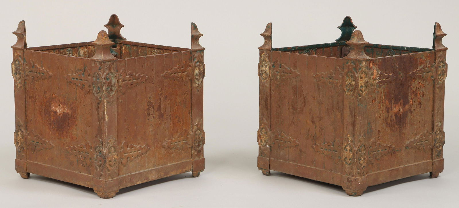 Pair of cast iron square planters: Pair of cast iron square garden gate planters, each panel signed, late 19th/early 20th century. Applied decoration to sides removed, one with crack to corner and bottom. 17''h, 14-1/4''sq. IMPORTANT S