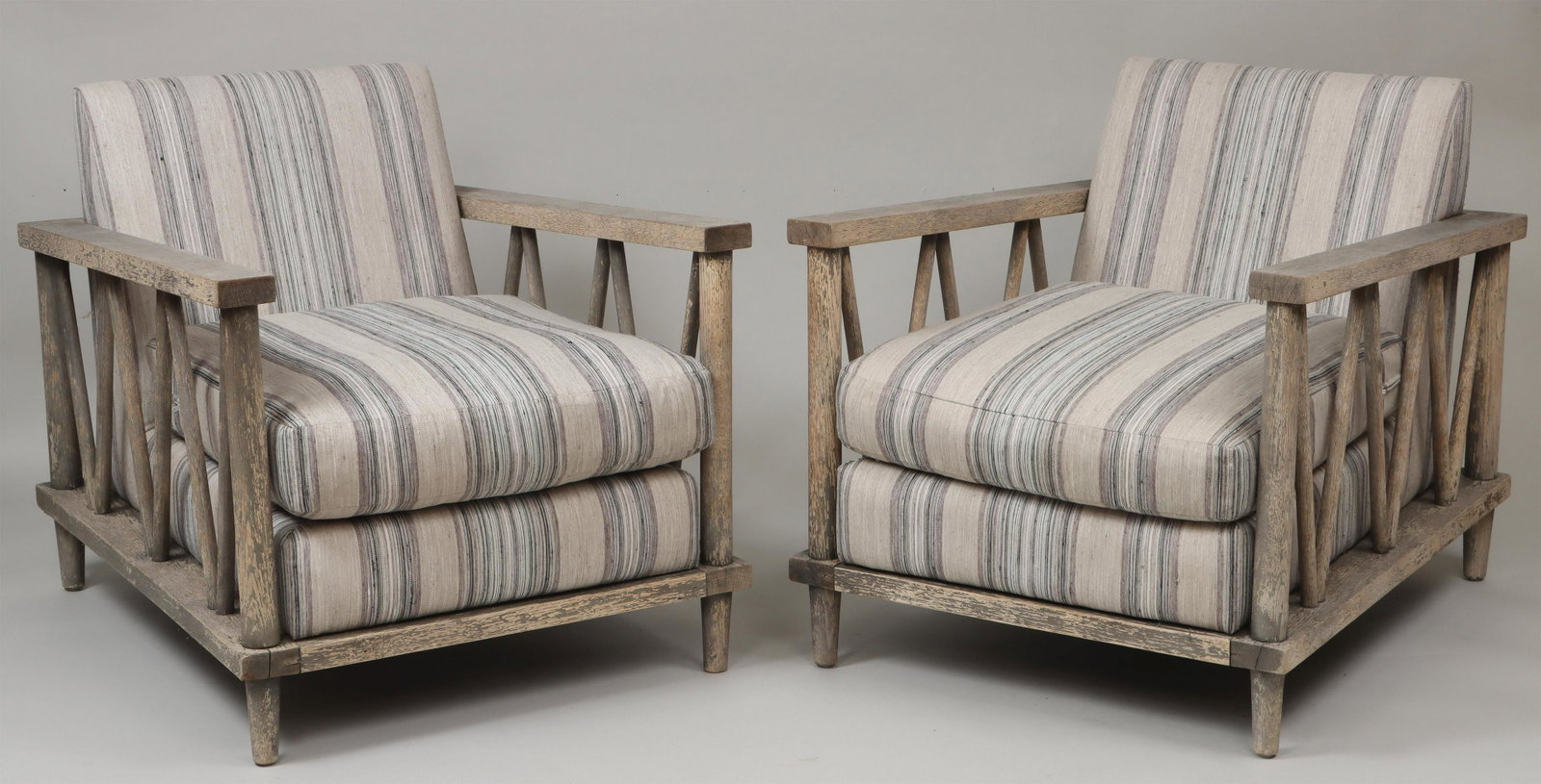 Pair of teak deck arm chairs: Pair of teak deck arm chairs with striped cushions. Flaking grey paint. 31''h, 30-1/4''w, 37-1/4''d. IMPORTANT SHIPPING INFORMATION 1 - LIVE-SHIPPING : The service is provided by Liveauctioneers. This