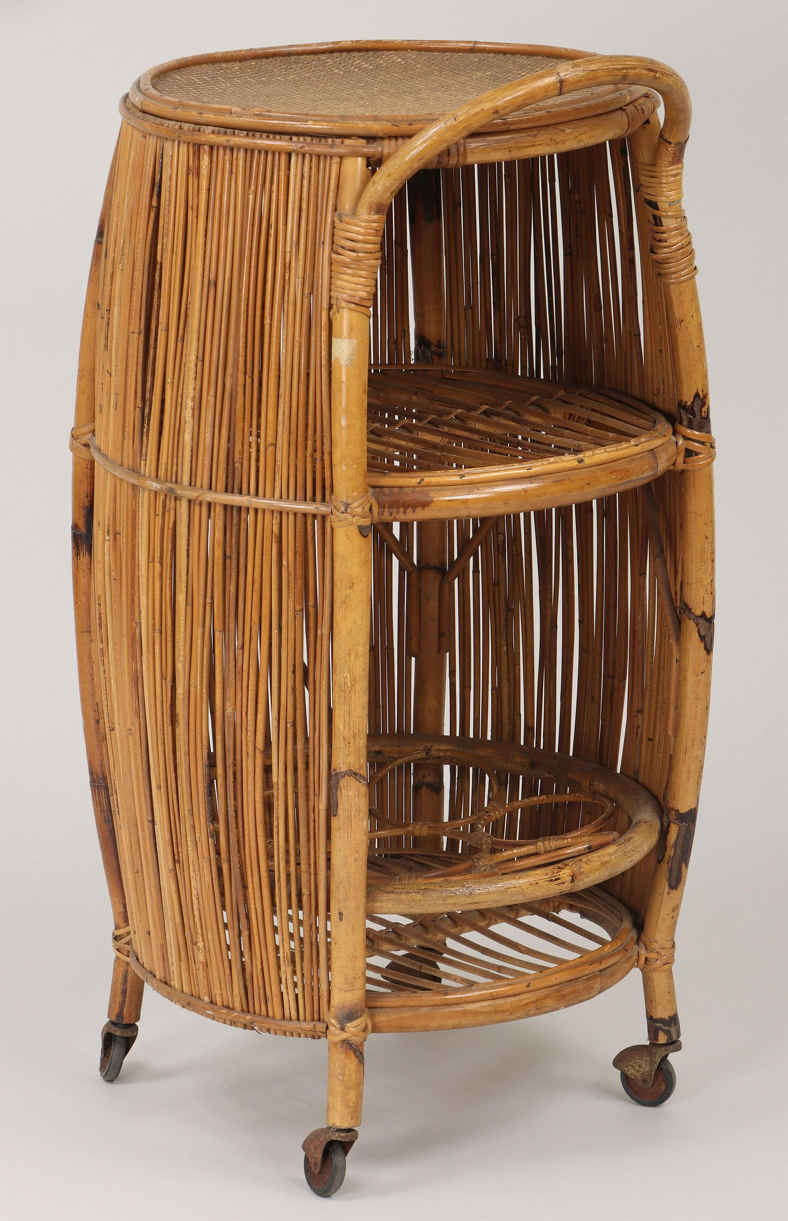 Mid-century bar cart: Mid-century reeded bamboo barrel-form bar cart. Some loose wraps. 35-1/4''h (excluding handle), 20''dia. IMPORTANT SHIPPING INFORMATION 1 - LIVE-SHIPPING : The service is provided by Liveauctioneers. 
