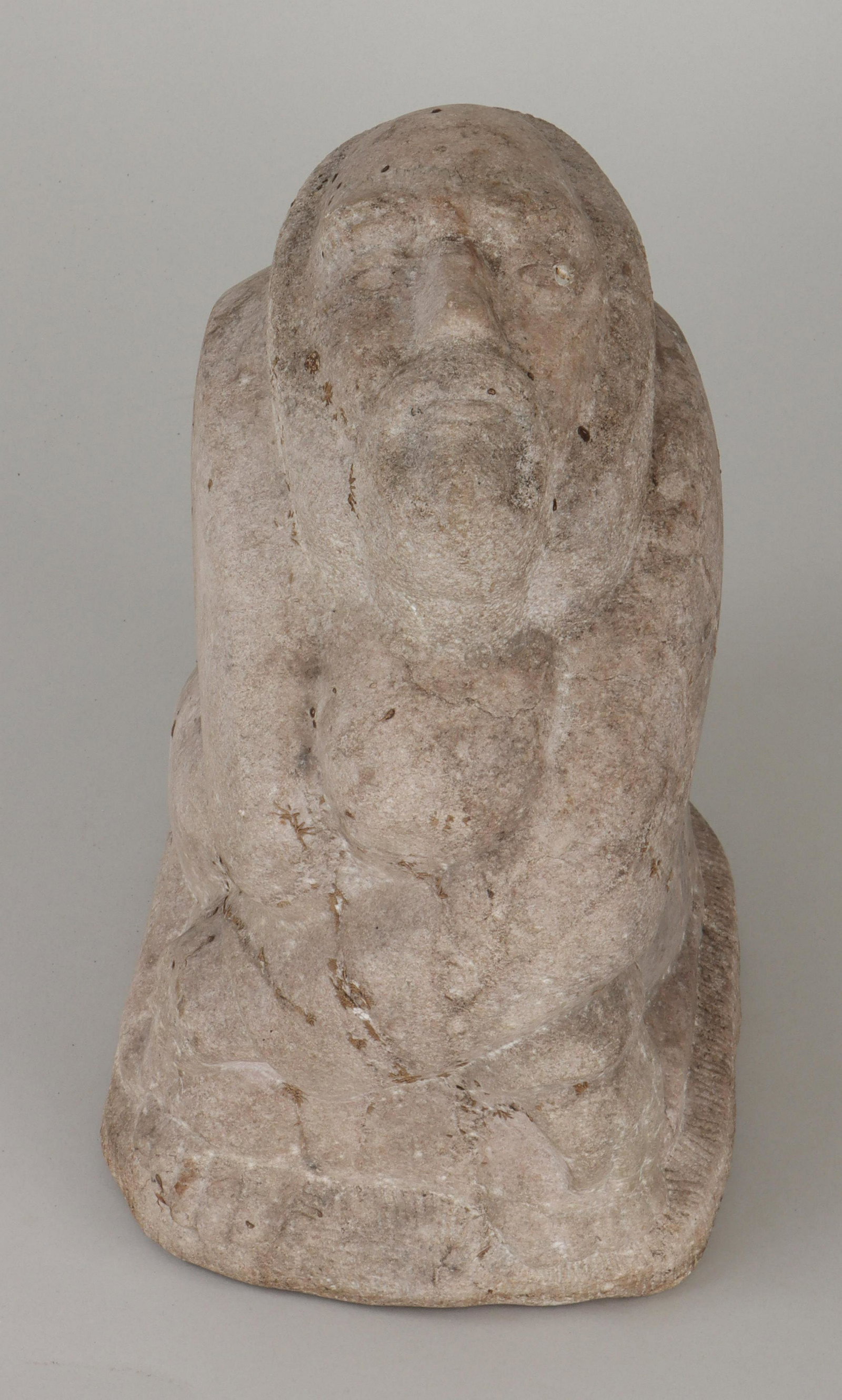 JOHN TERKEN: JOHN TERKEN (American, Long Island, 1912-1993), seated man, 1976, carved stone, signed ''Terken'' and dated to right side. Repaired chip to bottom. 16''h, 10-1/2''w, 8-1/2''d. IMPORTANT SHIPPING INFOR