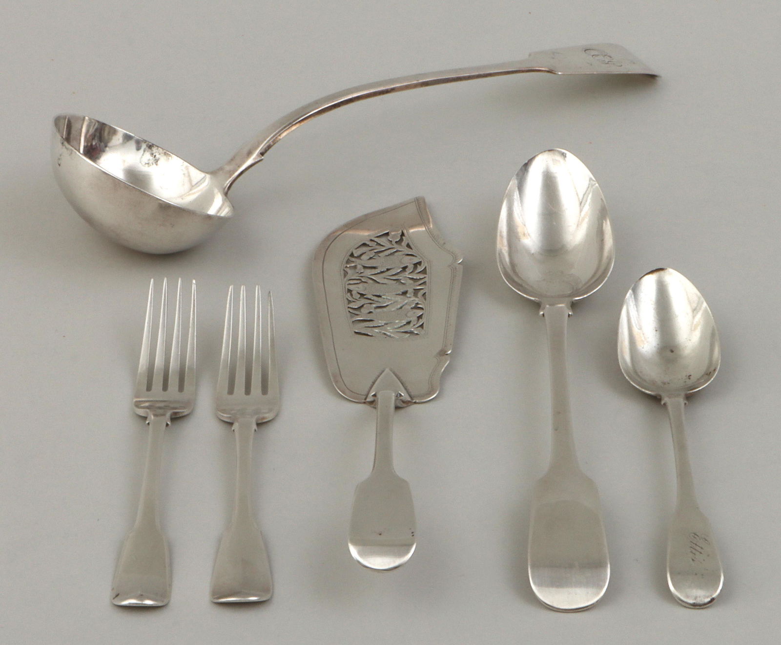 Georgian and Victorian sterling flatware: Group of (6) Georgian and Victorian sterling silver flatware, London, 19th century, to include: (2) George III dinner forks, with tipt handles, one Christopher & Thomas Wilkes Barker, 1804, with engra