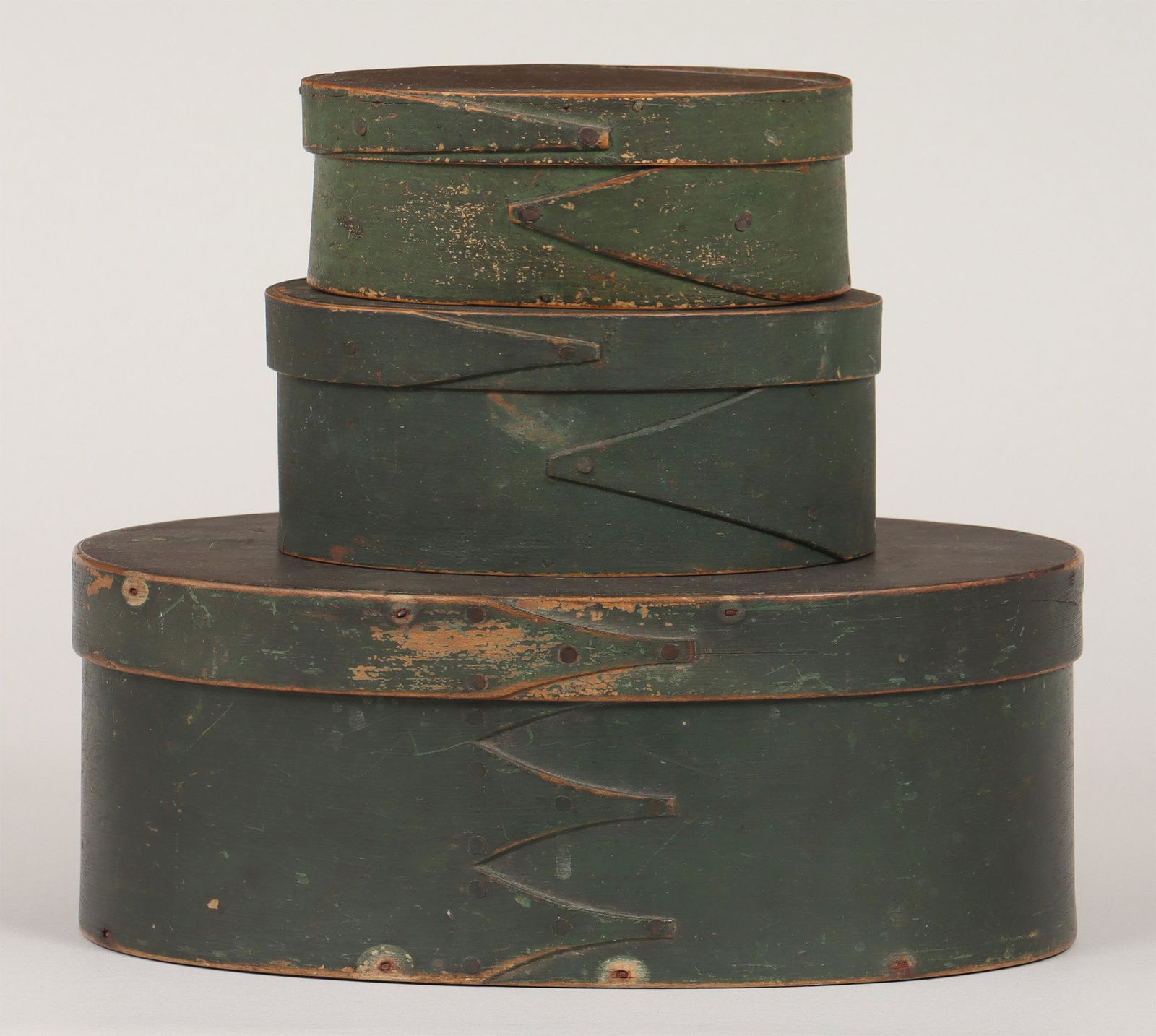 Group of (3) green-painted oval pantry boxes: Group of (3) green-painted oval pantry boxes, to include: Shaker-style box; and (2) small boxes, each with two finger laps, one inscribed ''Ram _'' on top, (one with stains, other with loss). Minor sp