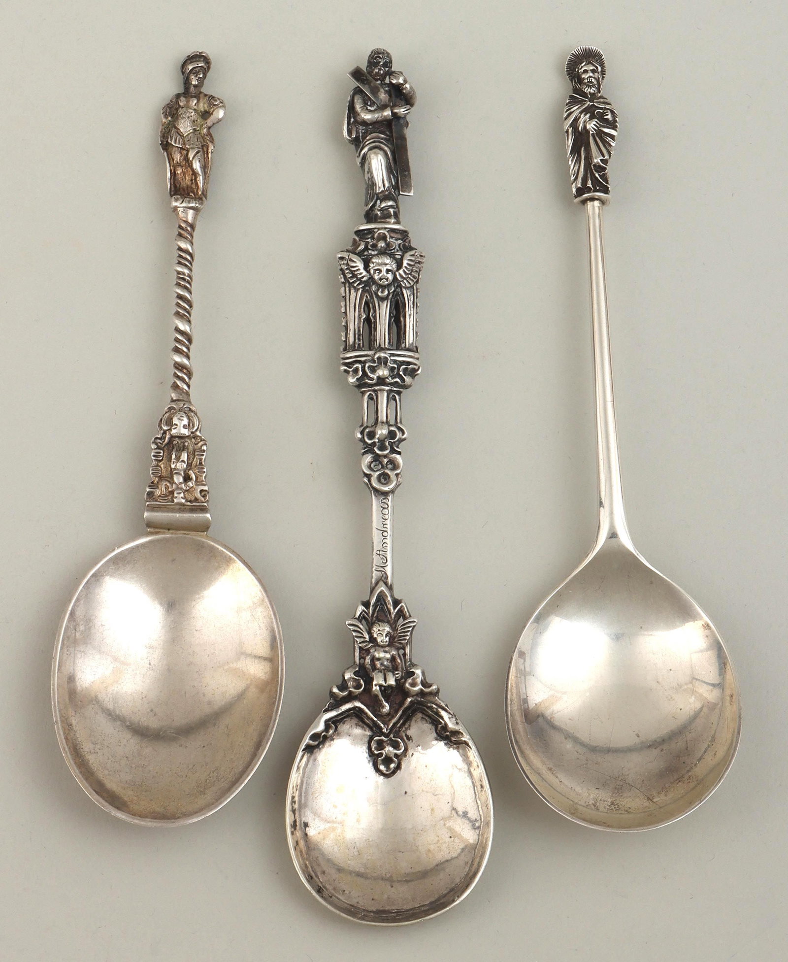 European silver apostle spoons: Group of (3) European silver apostle spoons, to include: Victorian spoon, John & Frank Pairpoint, London, 1883, with twist handle terminating in mask and figure framed by scrolled border, hallmarked; 