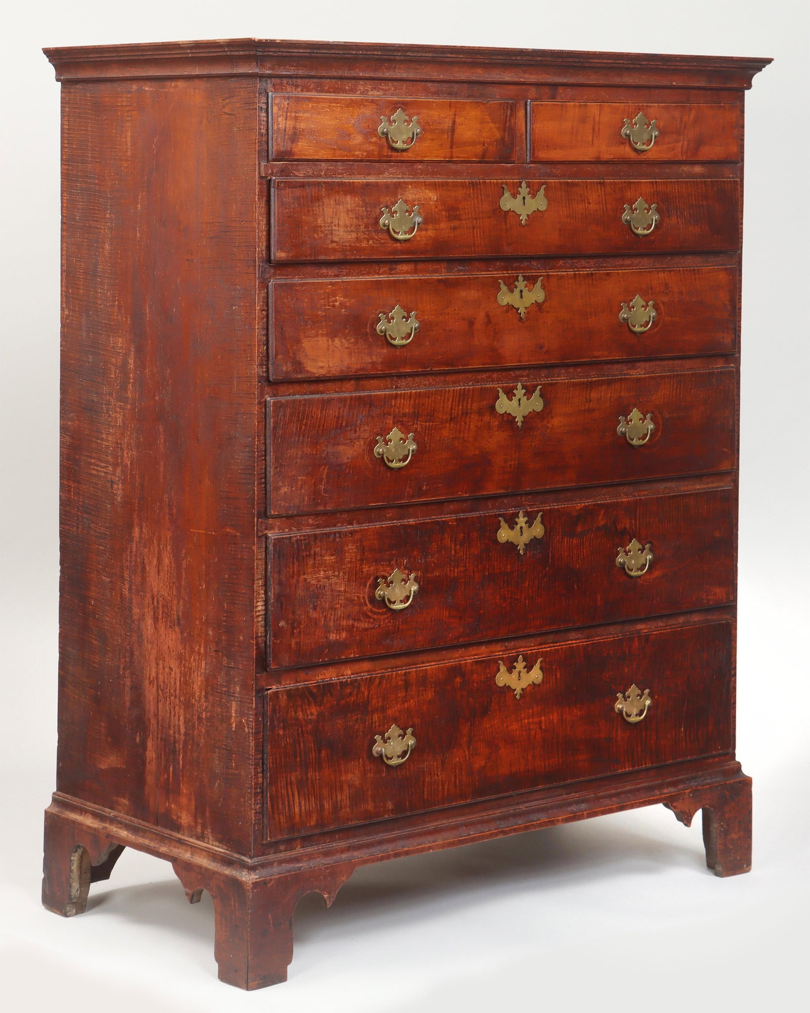 18C New England tiger maple tall chest: 18th century New England tiger maple seven-drawer tall chest with two short drawers over five, long graduated drawers, set on bracket base, in original finish. Shows wear from use, replaced hardware,