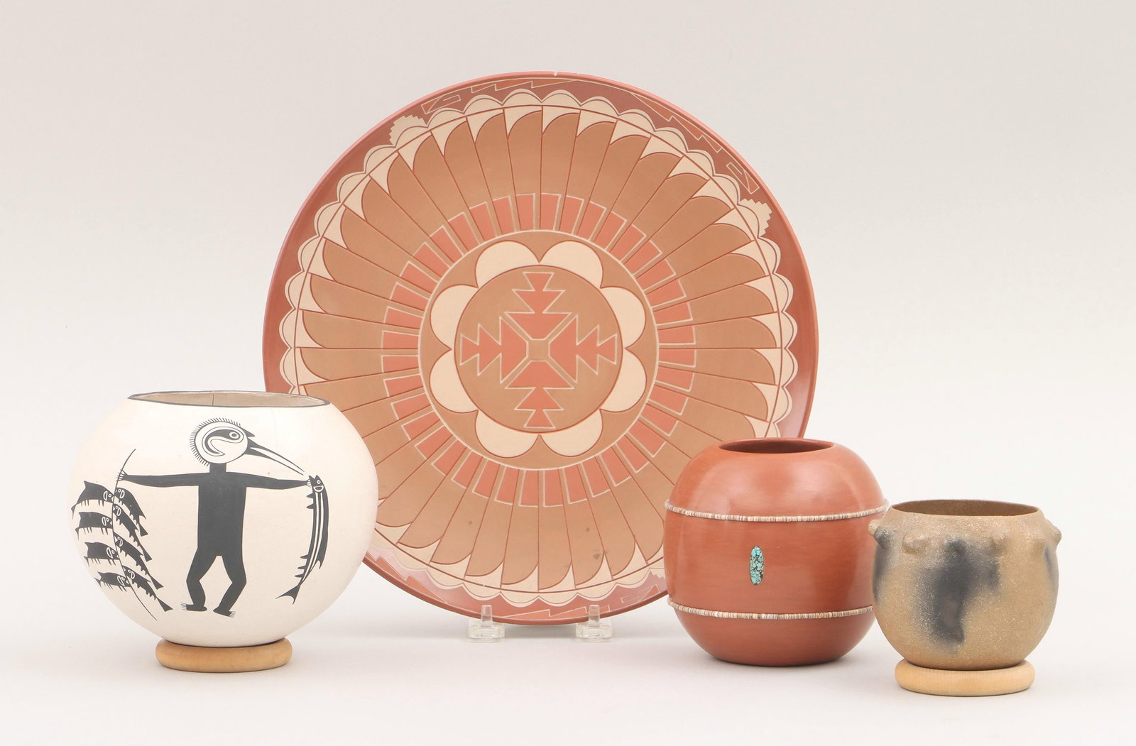 Group of (4) Native American pottery: Group of (4) Native American pottery, to include: ALVIN CURRAN (San Juan Pueblo, 1953-2000), redware plate with feathers, steps and geometric design, (minor nicks); EMMA LEWIS (Acoma, 1931-2013), pain