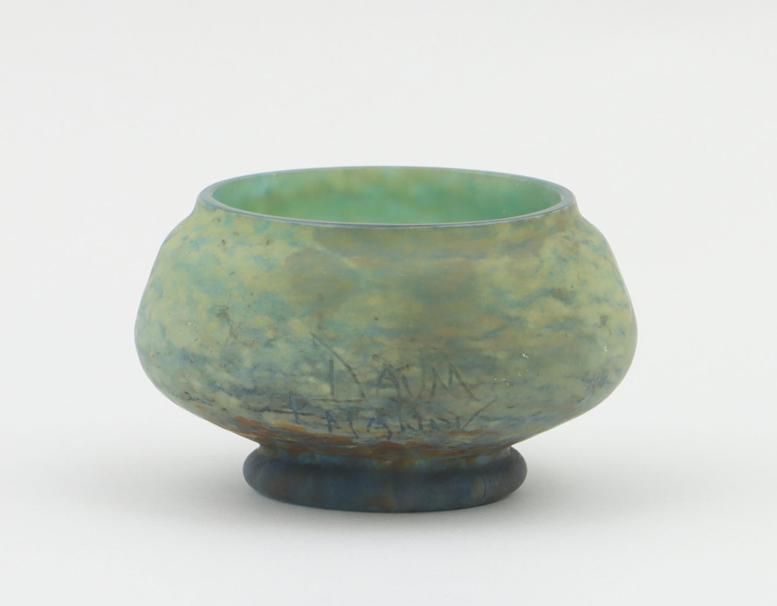 Daum Nancy footed glass bowl: Daum Nancy footed glass bowl, marked ''Daum Nancy'' with cross of Lorraine on side. Fleabite, minor dirt and grime. 3-3/8''h, 5-1/2''dia.