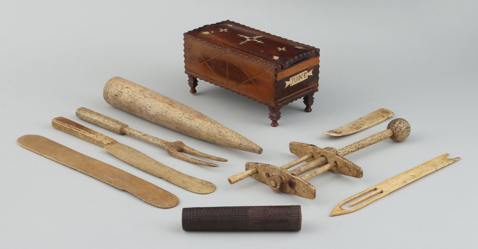 19th century sailor made items: 19th century sailor-made wood box and tools, to include: 19th century sewing box with inlaid decoration, notched edges and shaped feet, inscribed ''Julia'' and ''Cattermole'' and dated ''June'' and ''
