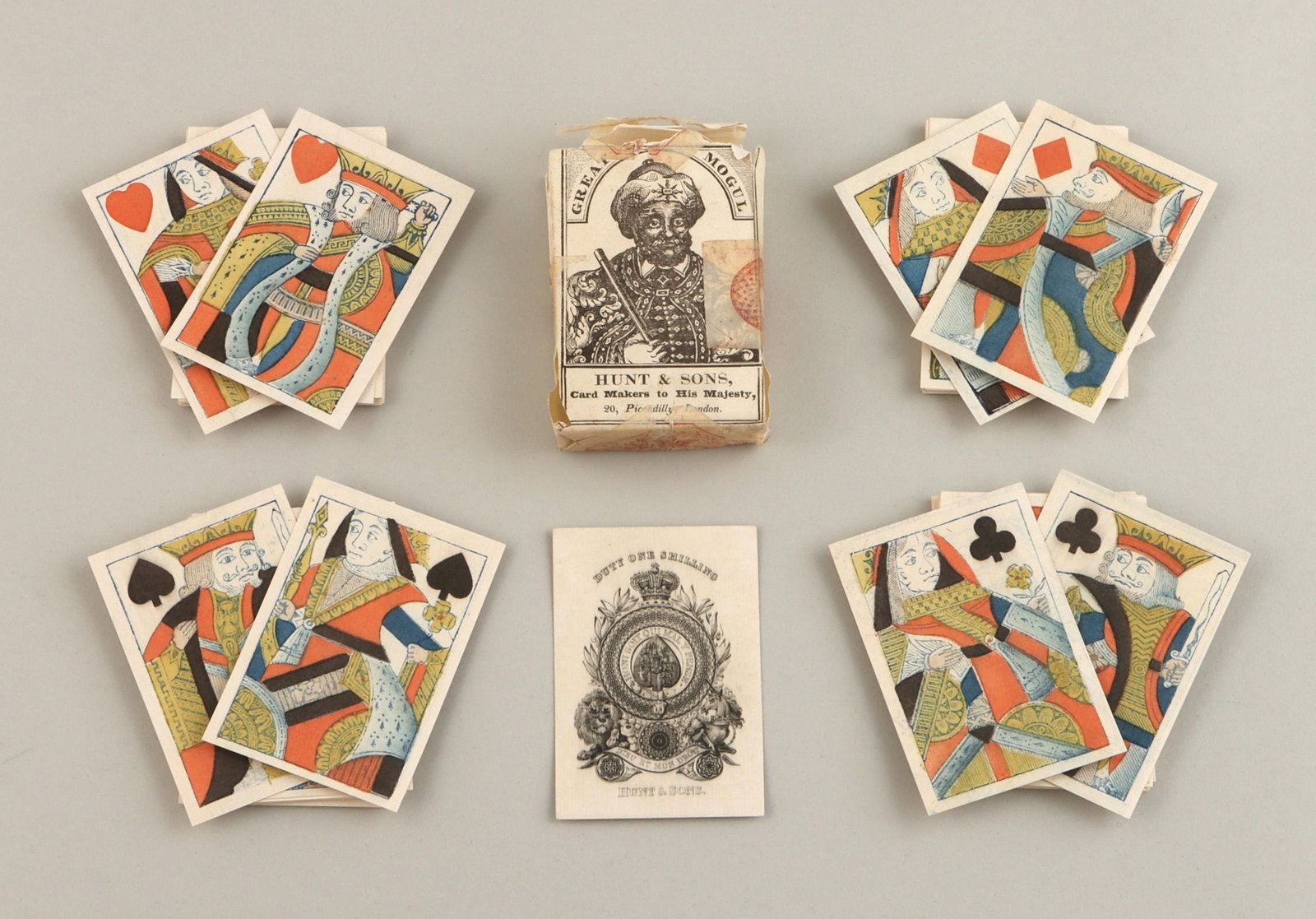 Hunt & Sons, English standard playing cards: Hunt & Sons, English standard pack of 52 playing cards, circa 1830, having woodcut court cards with pochoir colors and original wrapper. Cards 3-3/4''h, 2-1/2''w. Provenance: Purchased at Sotheby Park