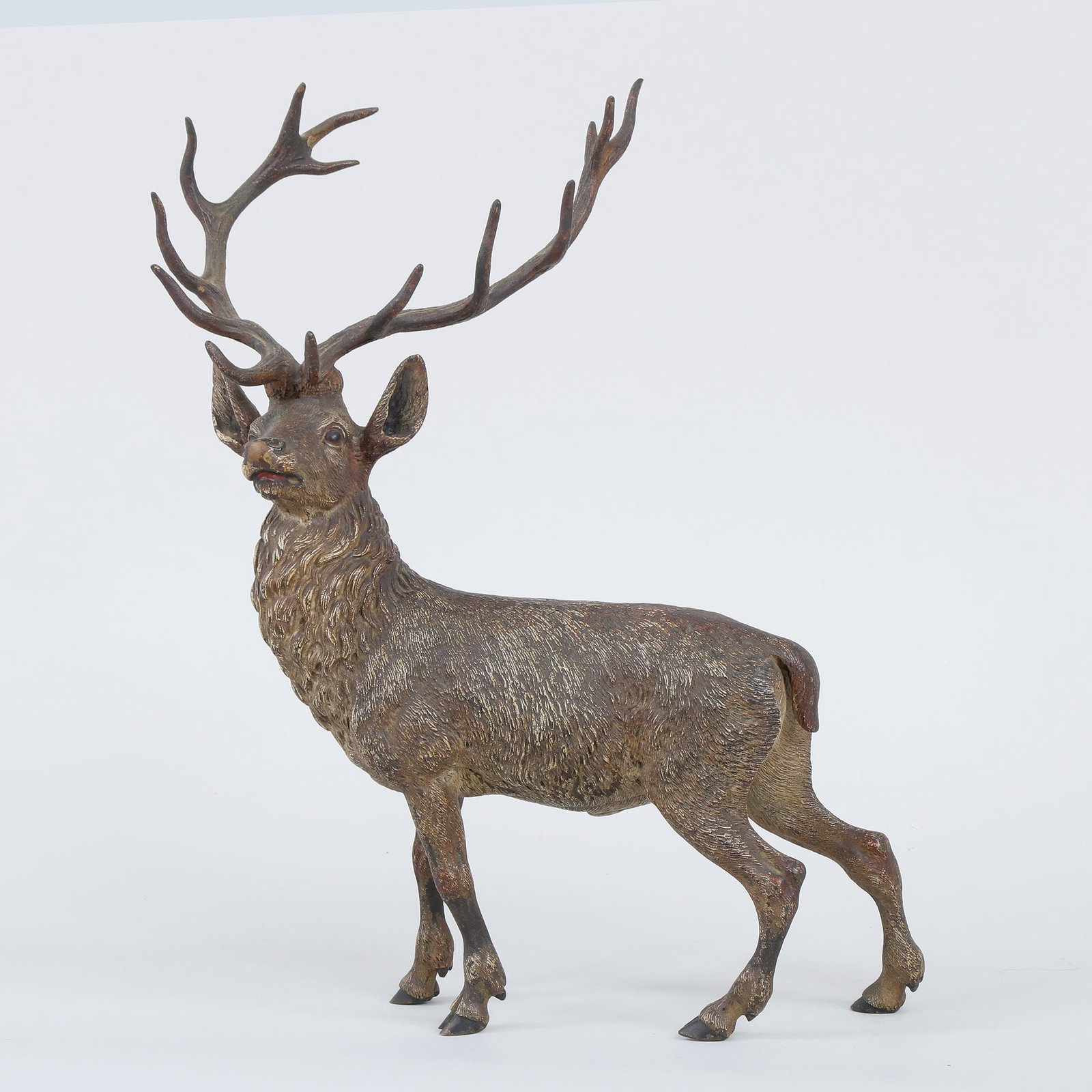 Large Vienna cold-painted bronze stag: Large Vienna cold-painted bronze stag, appears unsigned. Some rubbing and paint loss. 12-1/2''h, 10-1/2''w, 5-1/2''d.