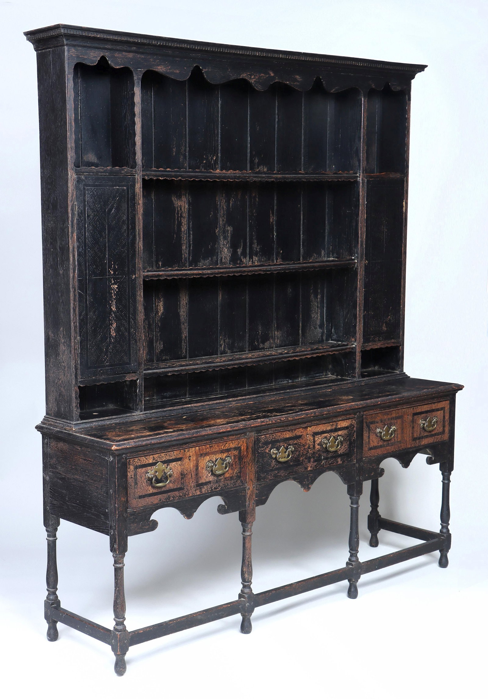 Painted Welsh cupboard: Painted Welsh cupboard, the upper section with cornice having dental molding, and shaped frieze over three shallow shelves with scalloped detail, flanked by single cupboard doors, set on a base with t
