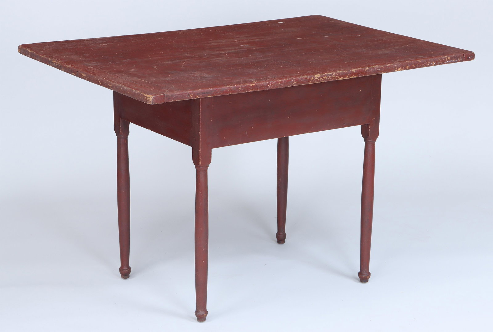 18th/19th century New England tavern table: 18th/19th century painted New England tavern table having single board rectangular top with breadboard ends, on straight turned legs with button feet, in red paint. Wear from use. 27-1/2''h, 42''w, 28