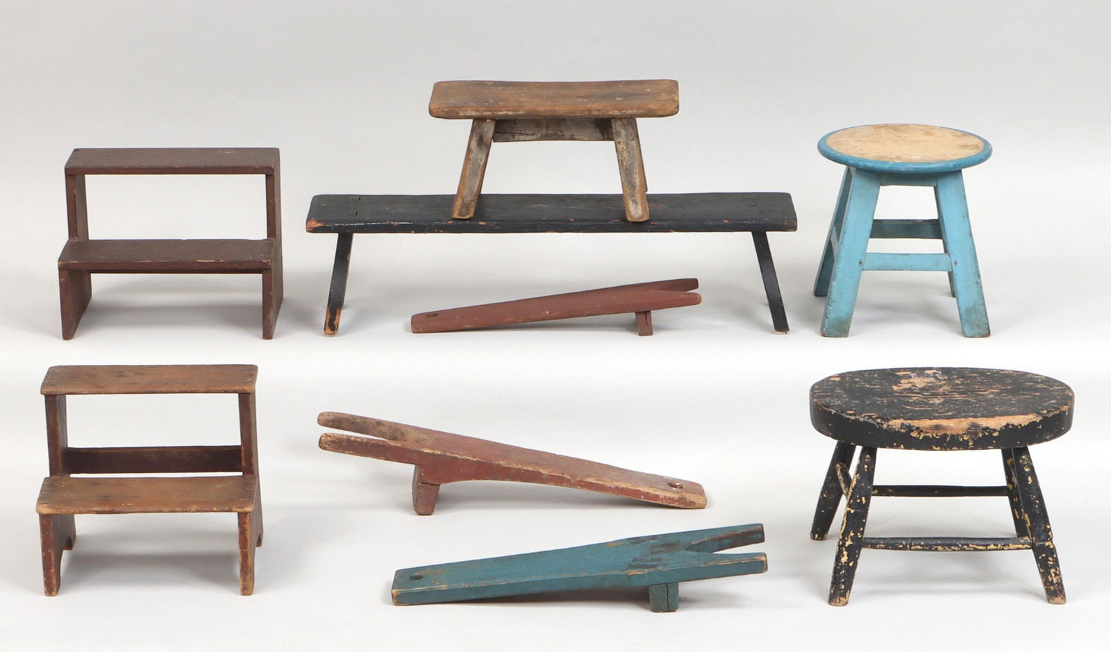 American country painted wood items: Group of (9) American country painted wood items, to include: (3) painted pine boot jacks, comprising (2) red-painted boot jacks, (one with small split), and a blue-painted boot jack with stenciled in