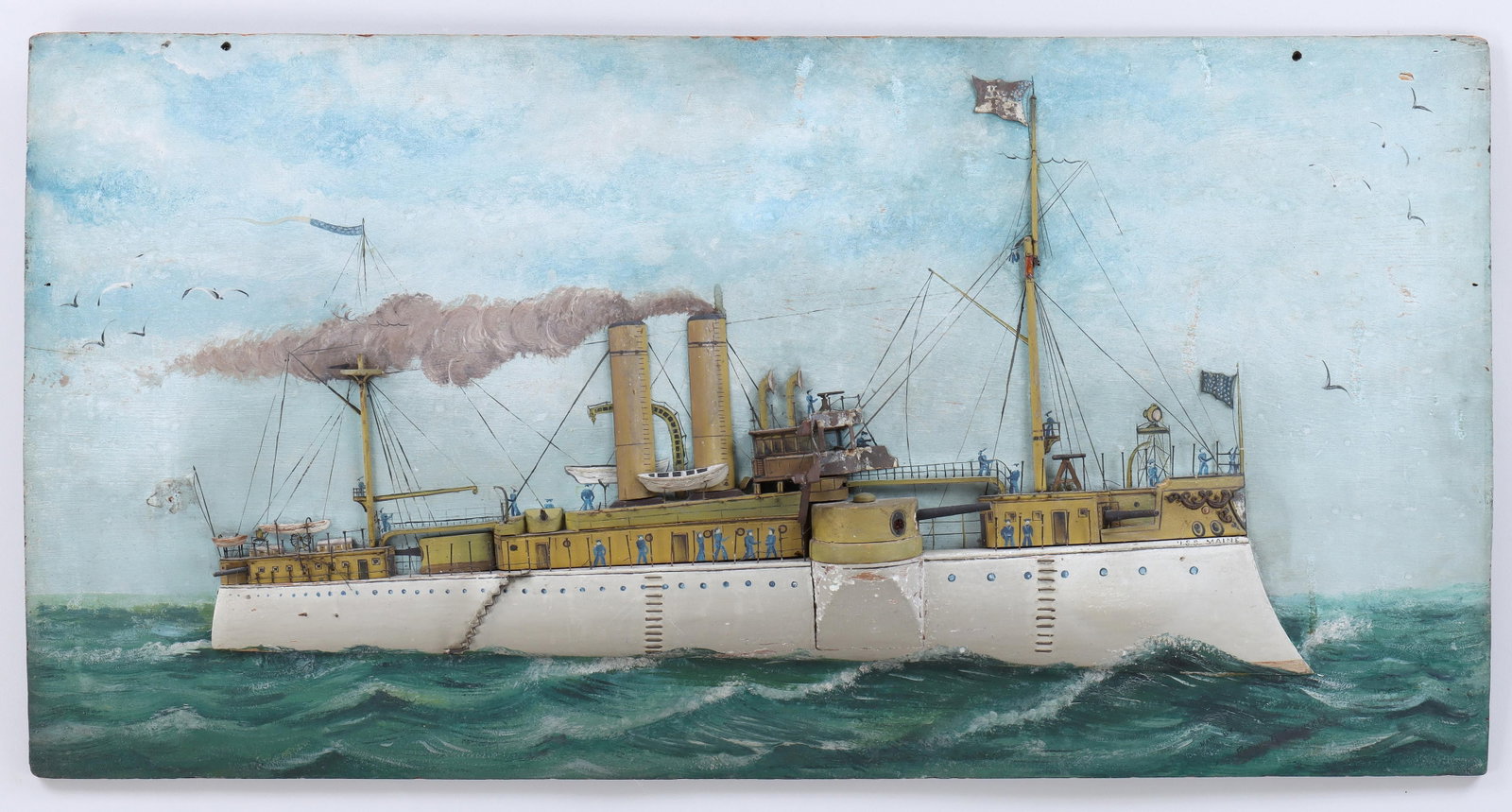 American folk art plaque, U.S.S. Maine: American folk art plaque depicting the U.S.S. Maine, painted wood and metal on panel, signed ''Made by Frank A. Fernekes'' at lower right. Losses, minor abrasions, some craquelure. 18-1/2''h, 36-1/4''