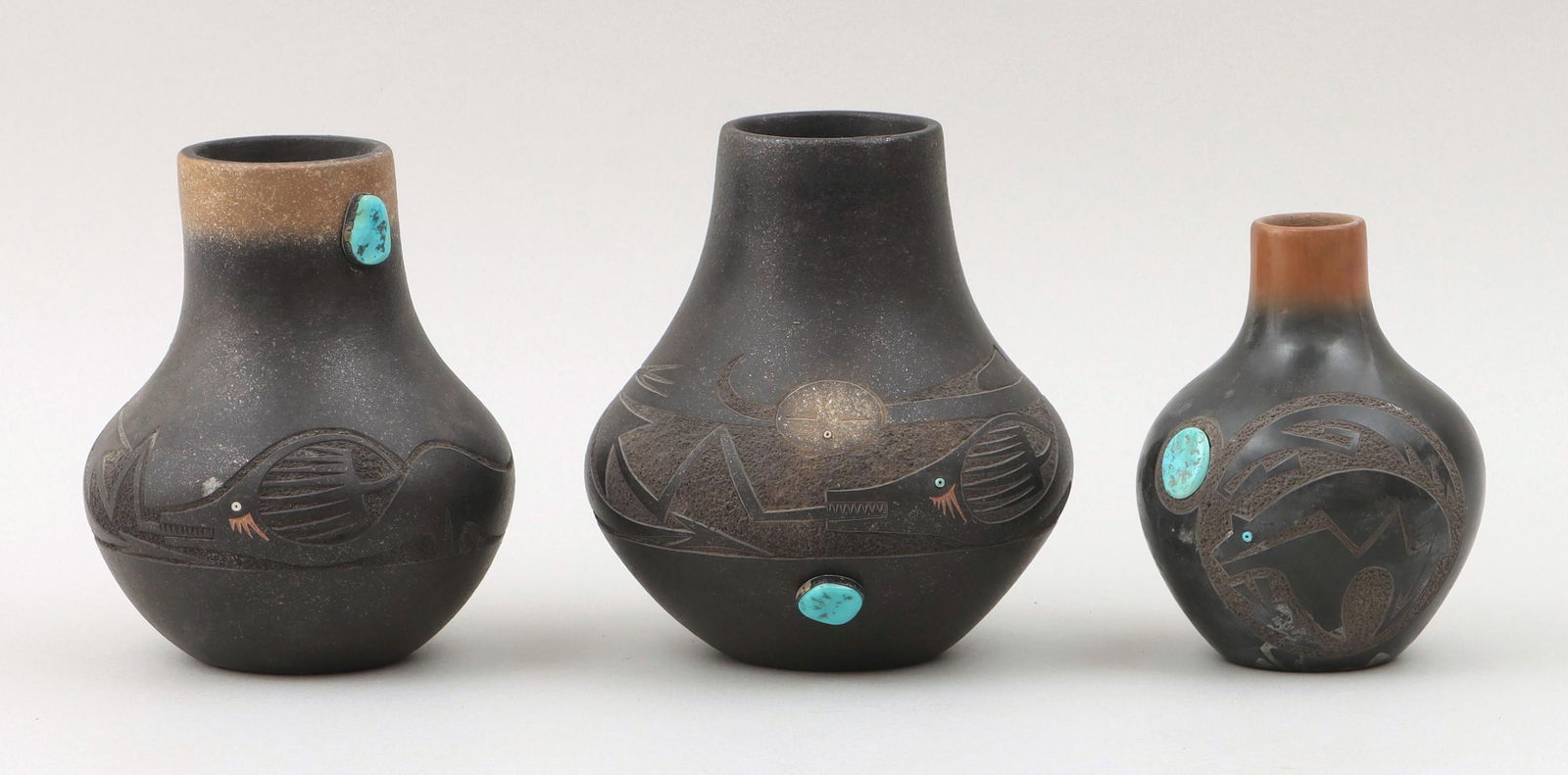 TSE-PE GONZALES (San Ildefonso Pueblo, 1940-2000): TSE-PE GONZALES (San Ildefonso Pueblo, 1940-2000), group of (3) sgraffito-carved black and sienna jars with turquoise, to include: (2) micaceous jars having applied turquoise stones set in painted met