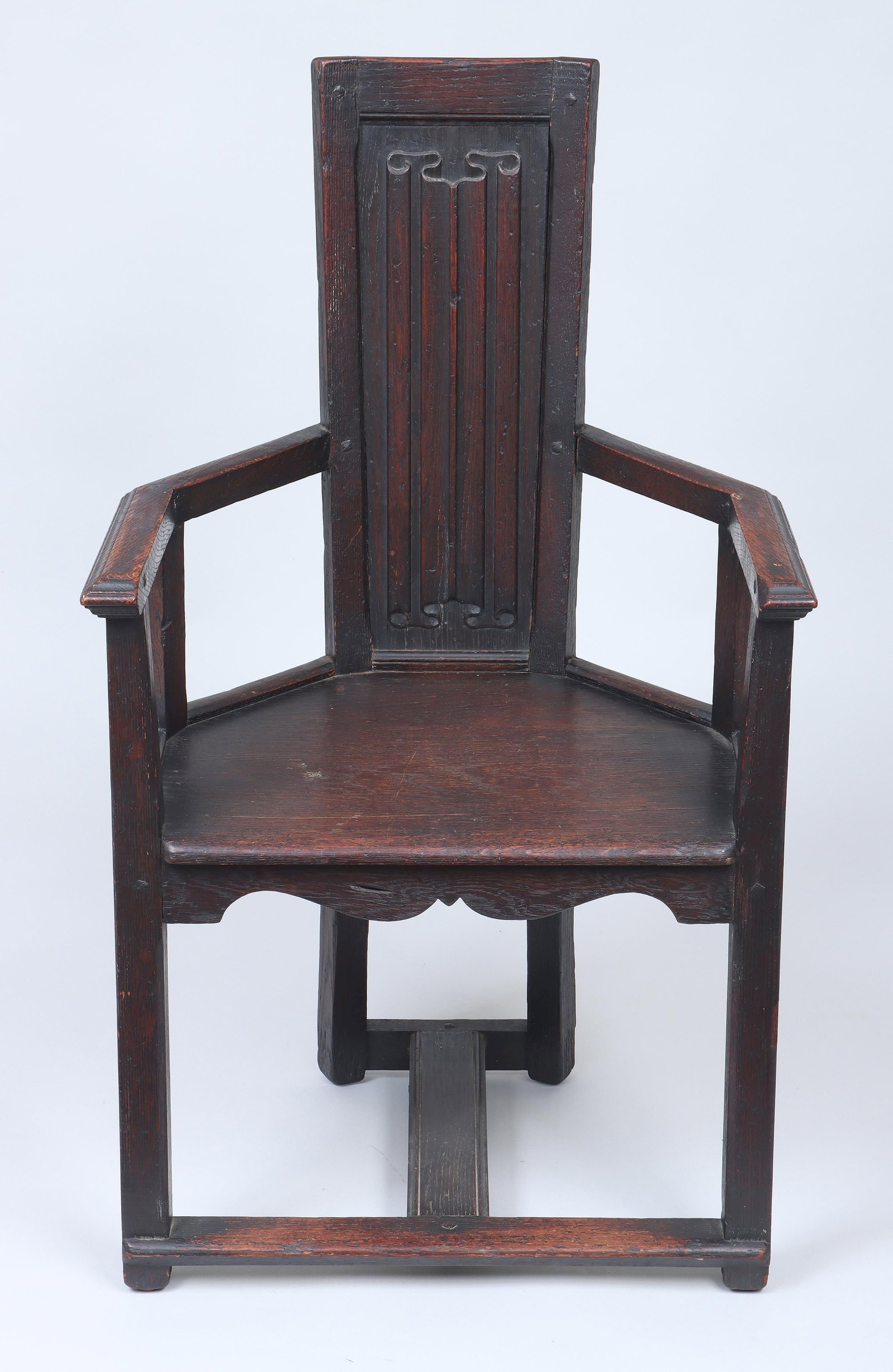 GEORGE MANN NIEDECKEN (American, 1878-1945): GEORGE MANN NIEDECKEN (American, 1878-1945), Arts & Crafts oak armchair with carved linenfold panel backrest. Wear from use. 41-1/4''h, 24-3/4''w, 21''d.
