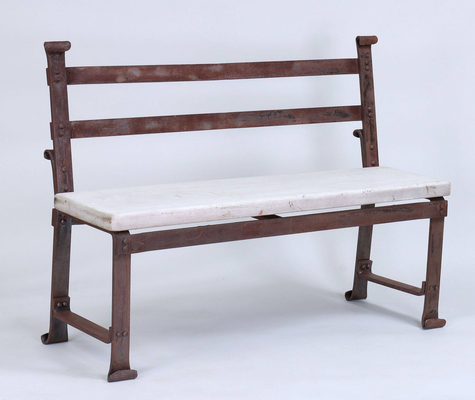 ARTURO DI MODICA (Italian/American 1941-2021): ARTURO DI MODICA (Italian/American 1941-2021), wrought iron bench with 1-3/4'' thick mahogany plank seat. Rust and loss of varnish. 34-1/2''h, 47-1/2''w, 16-1/2''d.