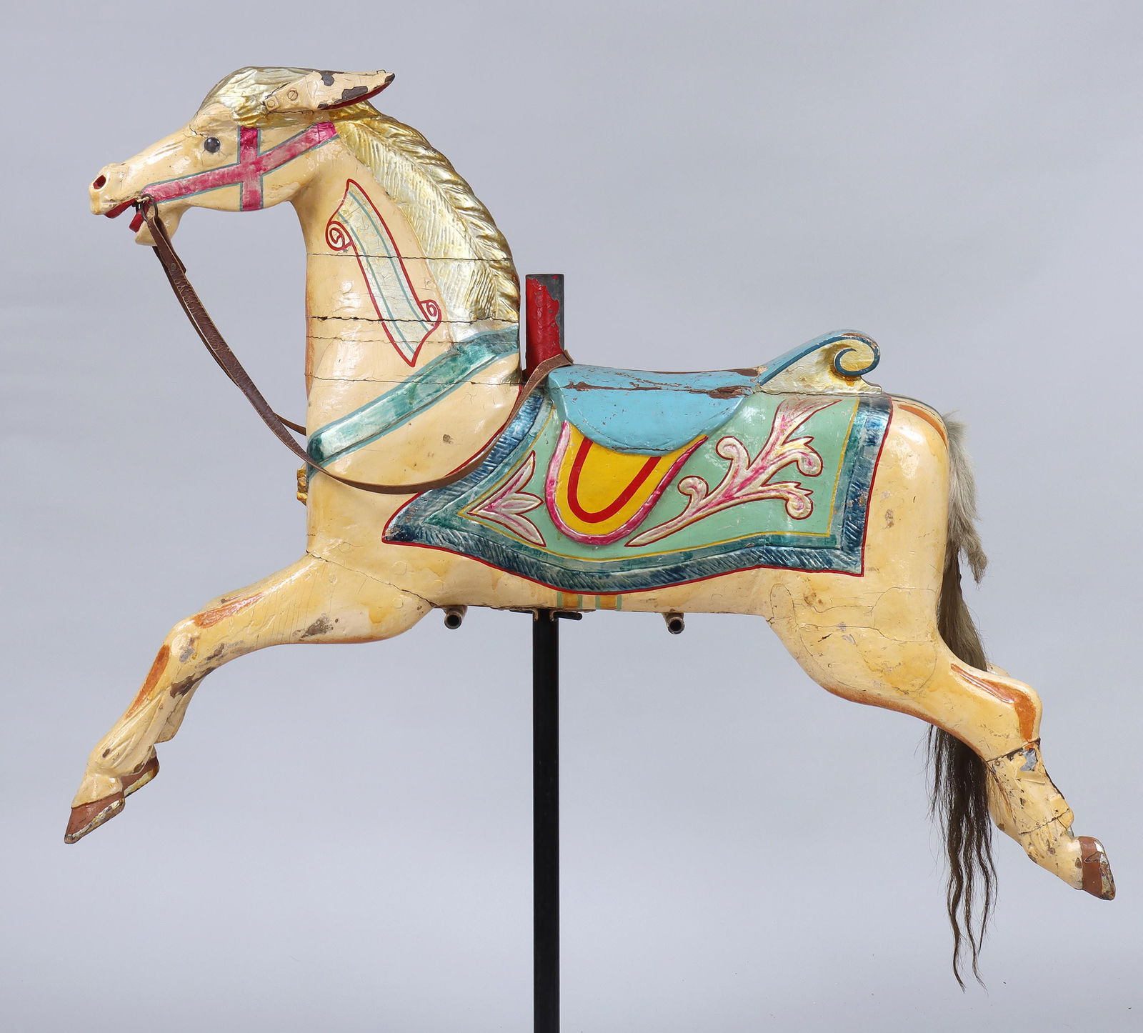 19th Century Folk Art Carousel Horse: Folk Art Carousel Horse19th centurycarved and painted wood, having leather reins and horsehair tail with hide, painted cartouche with name "Buller" on proper left neck, probably English.59 x