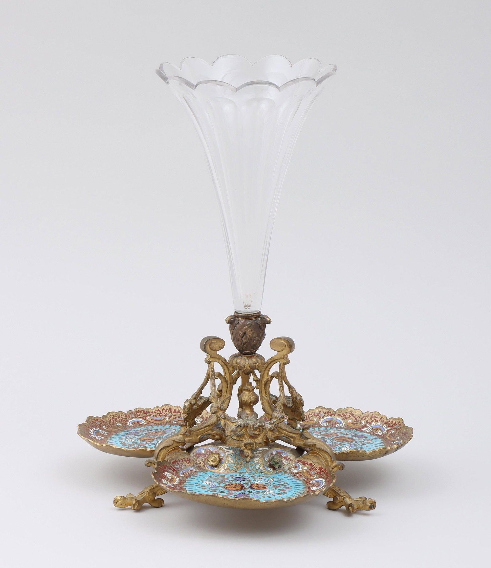 19thC French Gilt Bronze, Cloisonne and Glass Epergne: 19th Century French Gilt Bronze, Cloisonne and Glass Epergne The scalloped glass trumpet vase having a gilt bronze terminal with rams' heads and figures in relief, surrounded by a gilt bronze festoon 