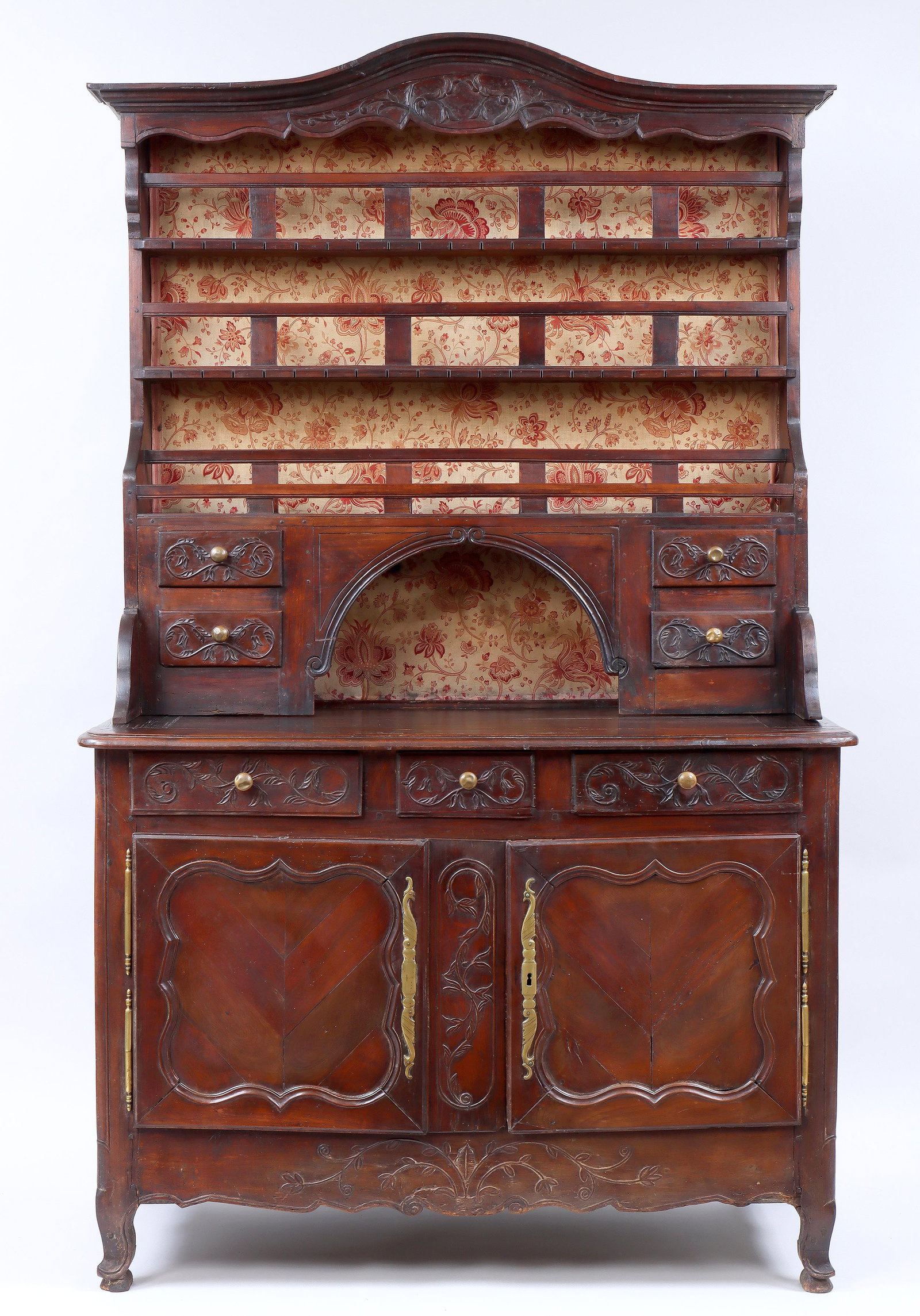 Carved French Provincial Oak Cabinet: Carved French Provincial Oak Cabinet having open arched top with plate and spoon racks, central arched recess flanked by two small drawers on each side, set on a rectangular-top cabinet with molded ed