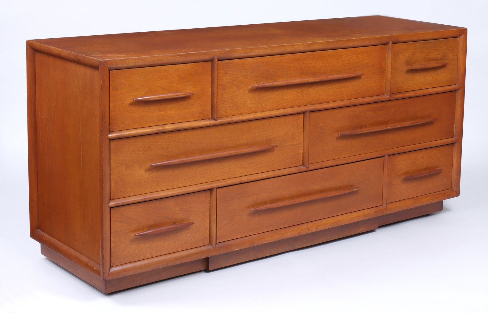 T. H. Robsjohn-Gibbings for Widdicomb: T. H. Robsjohn-Gibbings (British, 1905–1976) for Widdicomb Walnut Dresser having eight-drawers, the middle drawers with divided interior, label inside middle left drawer, in "Sherry" color