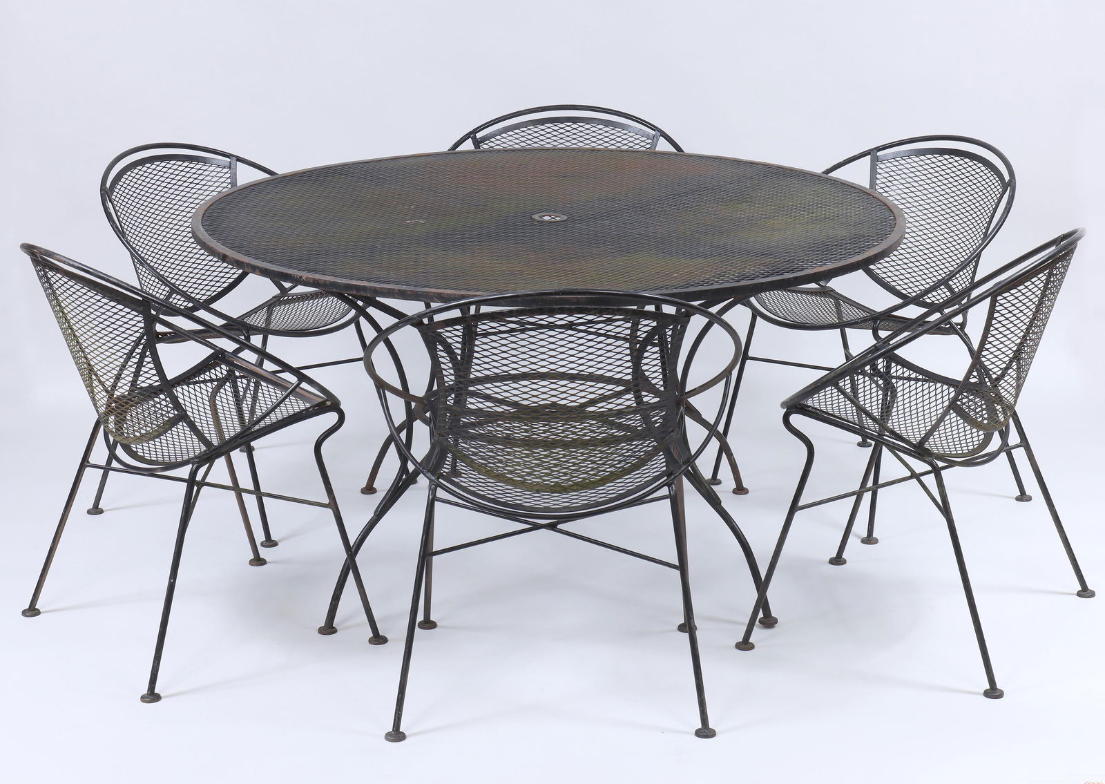 Maurizio Tempestini (Italian, 1908–1960) for Salterini "Radar" Set: Maurizio Tempestini (Italian, 1908–1960) for Salterini "Radar" Seven-Piece Dining Setwrought iron, to include (6) chairs and a circular screen top table.Table 27 1/2 x 54 in. (69.9 x 137.2