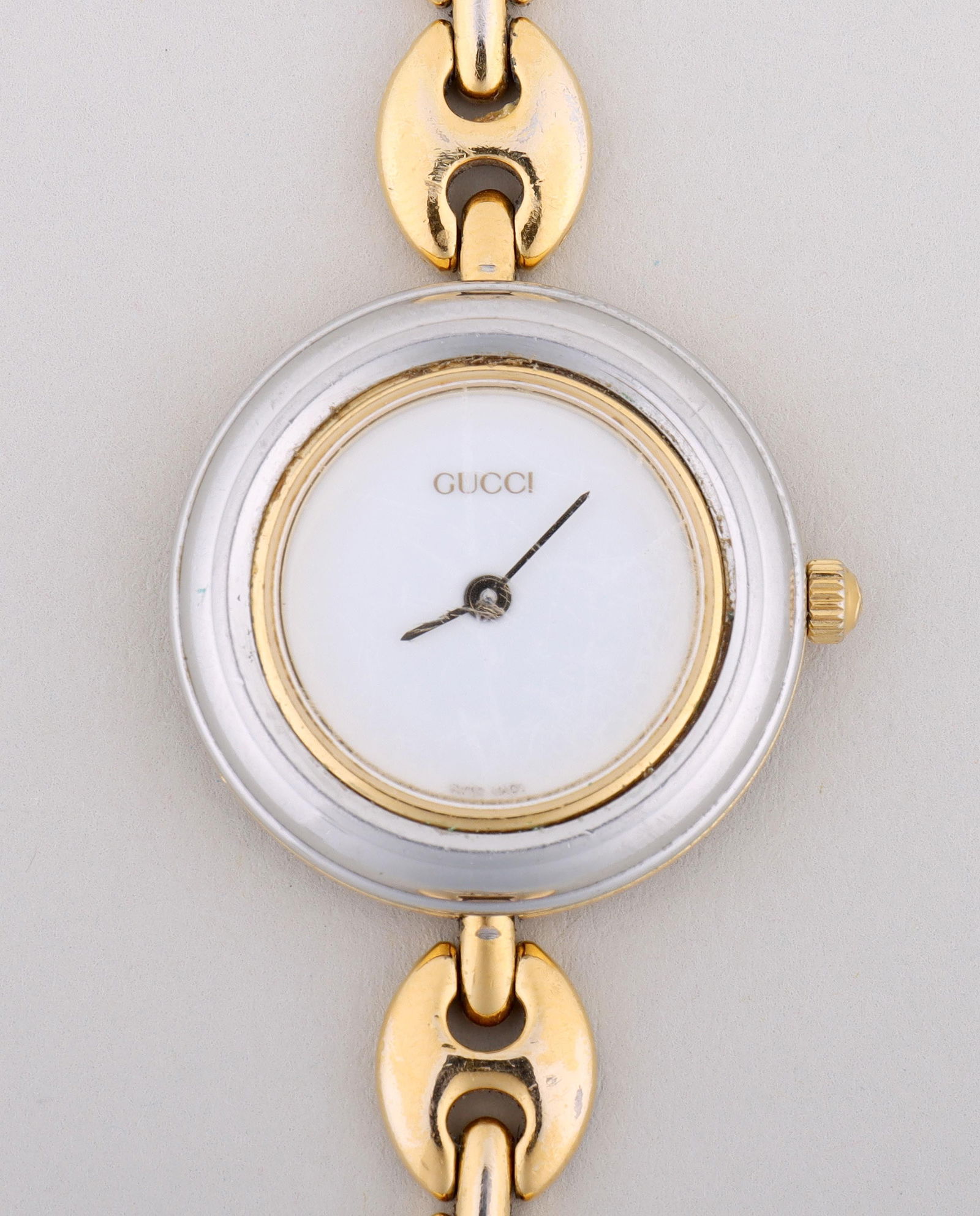Gucci Women's Wristwatch with Interchangeable Bezels: Gucci Women's Wristwatch with Interchangeable Bezelshaving gold-tone anchor chain band and round face with screw edge for interchangeable bezels, back of case marked and numbered “11/12.2” and