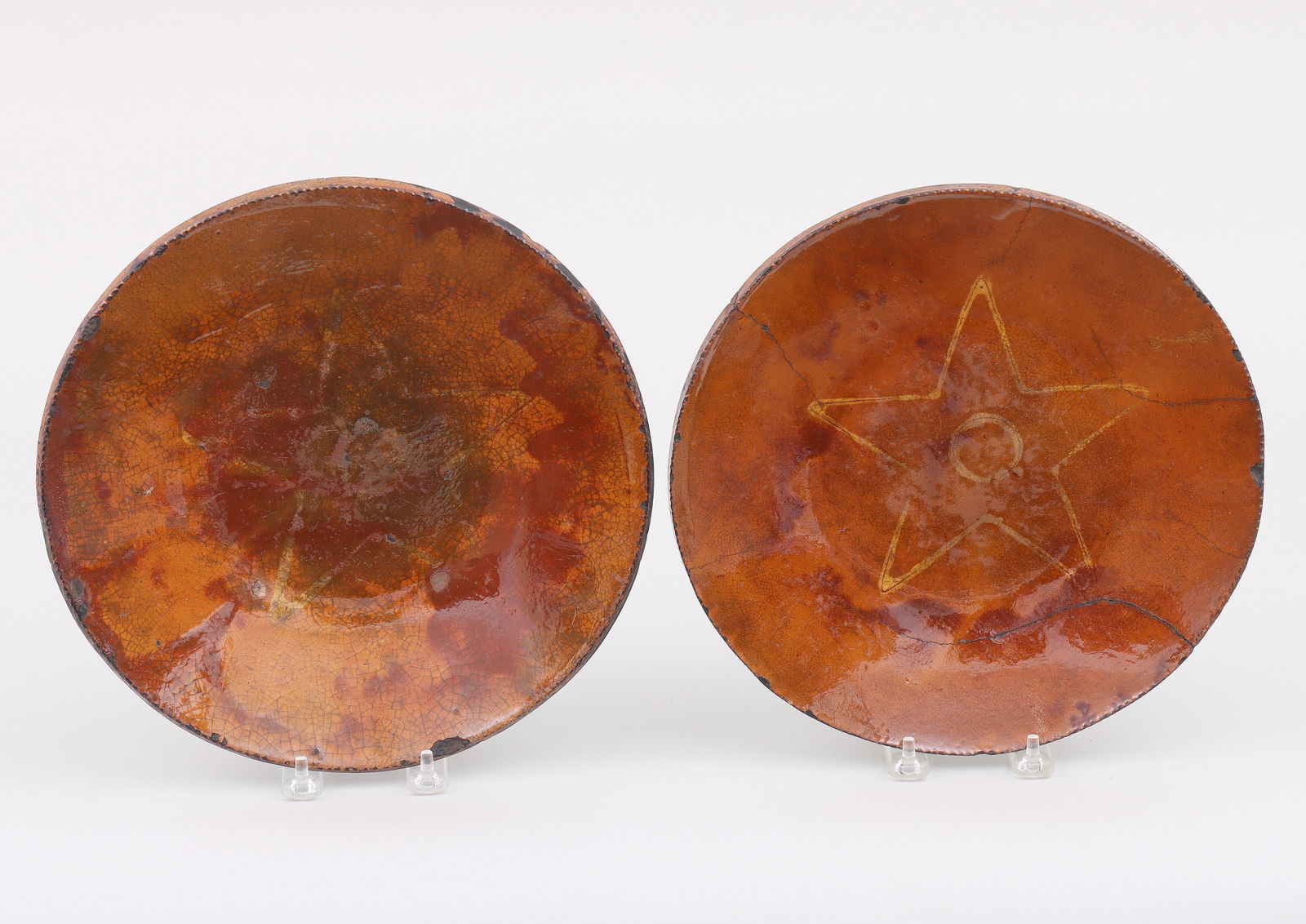 Pair 19th Century Long Island Redware Plates: Pair of 19th Century Long Island Redware Plateshaving coggled rims and slip decoration with circle inside of a five-point star.Larger 10-3/4”dia.