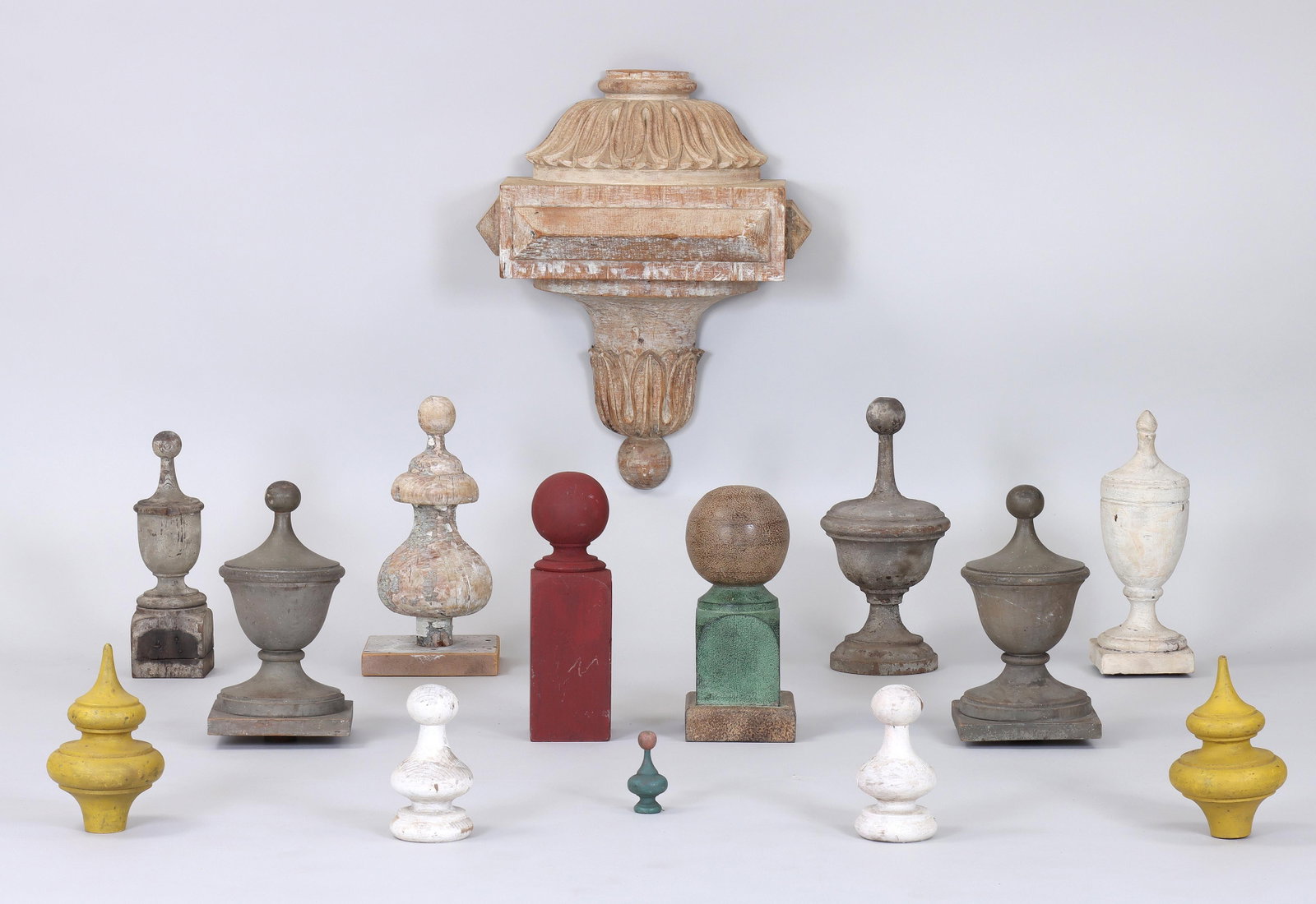 Group of (14) Turned and Painted Wood Finials: Group of (14) Turned and Painted Wood Finials 19th/20th century, including a 19th century carved and painted architectural ornament with applied molding. Ornament 22 3/4 x 17 3/4 x 8 3/4 in. (57.8 x 4
