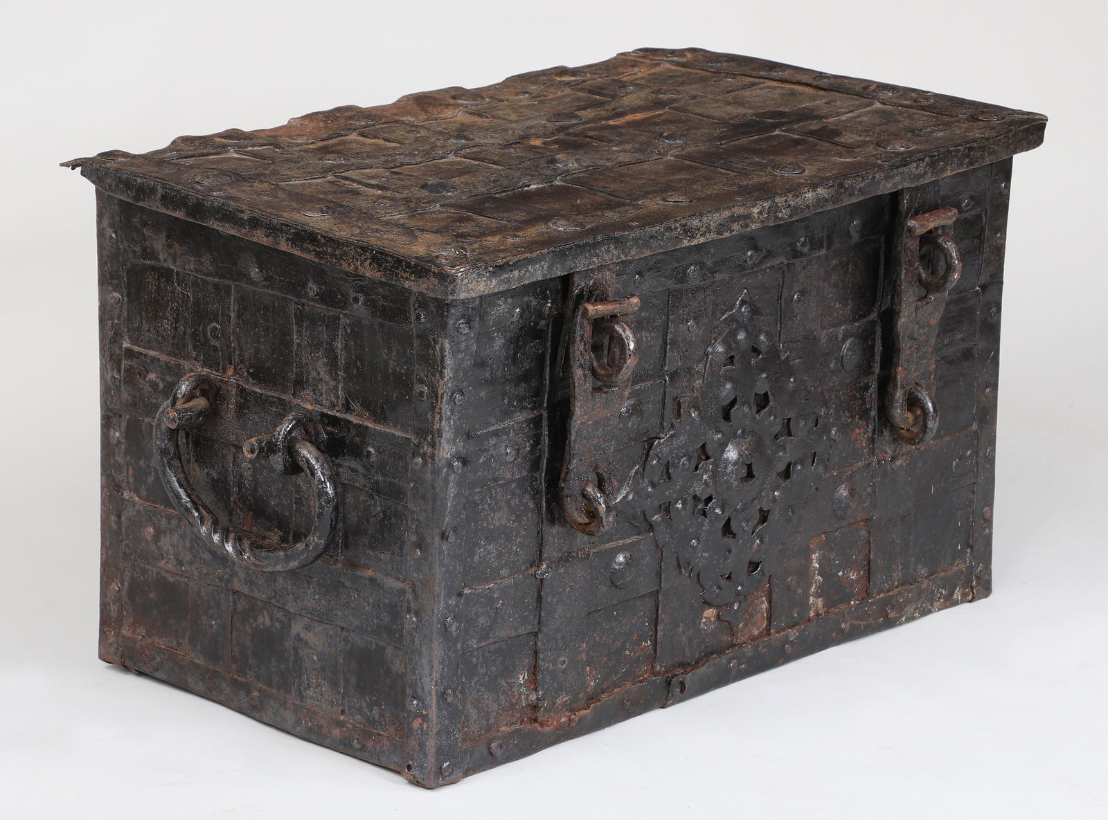 17th/18th Century Iron Strong Box: 17th/18th Century Iron Strong Boxwith strapwork, front-mounted hasps, and side-mounted carrying bales, the interior with holding bracket and till.18"h x 31"w x 19-1/4"d Provenance: Estate of William K