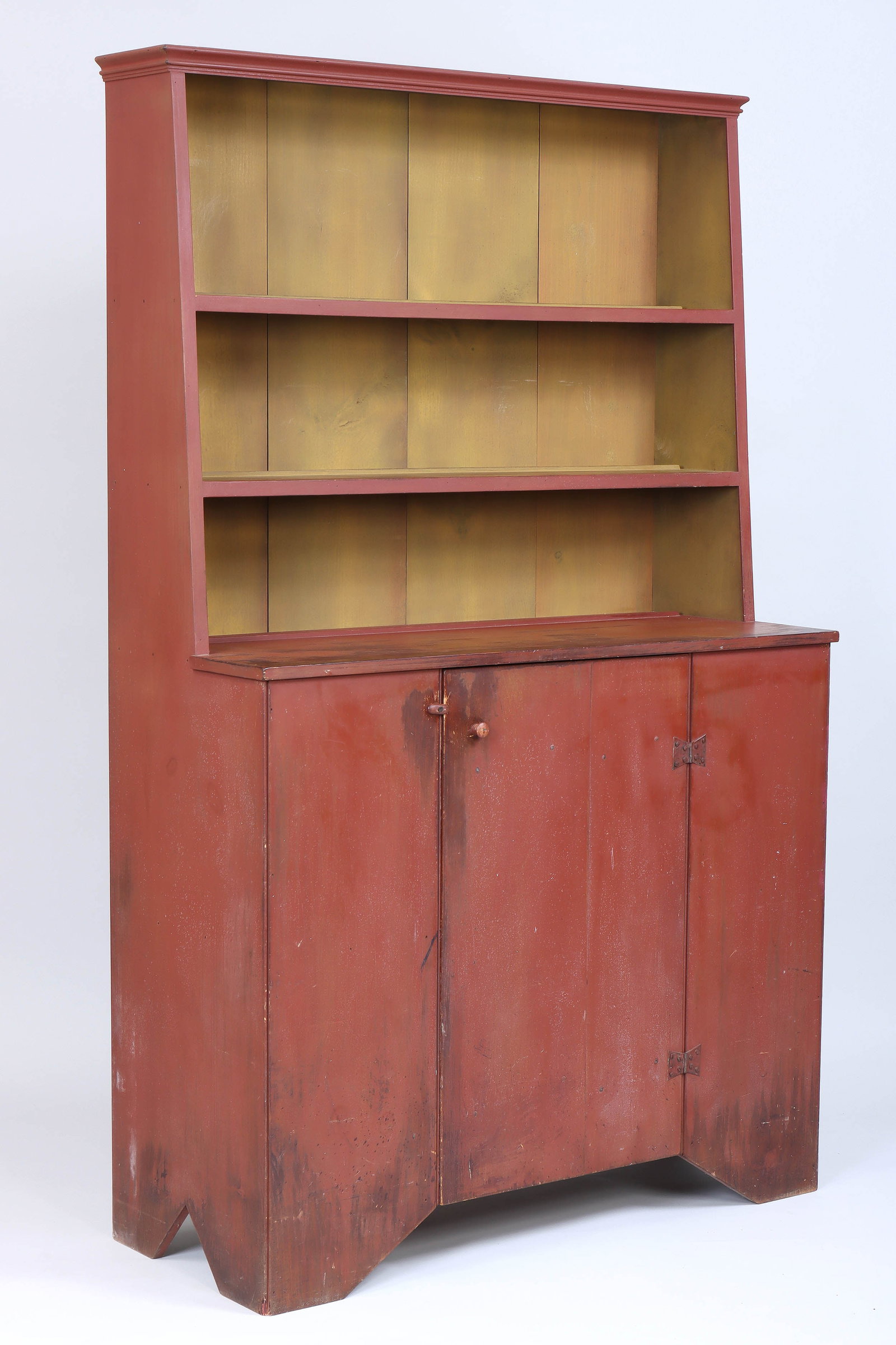 Simms & Thayer "Slant Back Hutch": Simms & Thayer "Slant Back Hutch" in red paint, with open-shelf top above a single door bottom, branded mark to back, second half of 20th century. 74 x 45 1/2 x 18 1/2 in. (188 x 115.6 x 47 