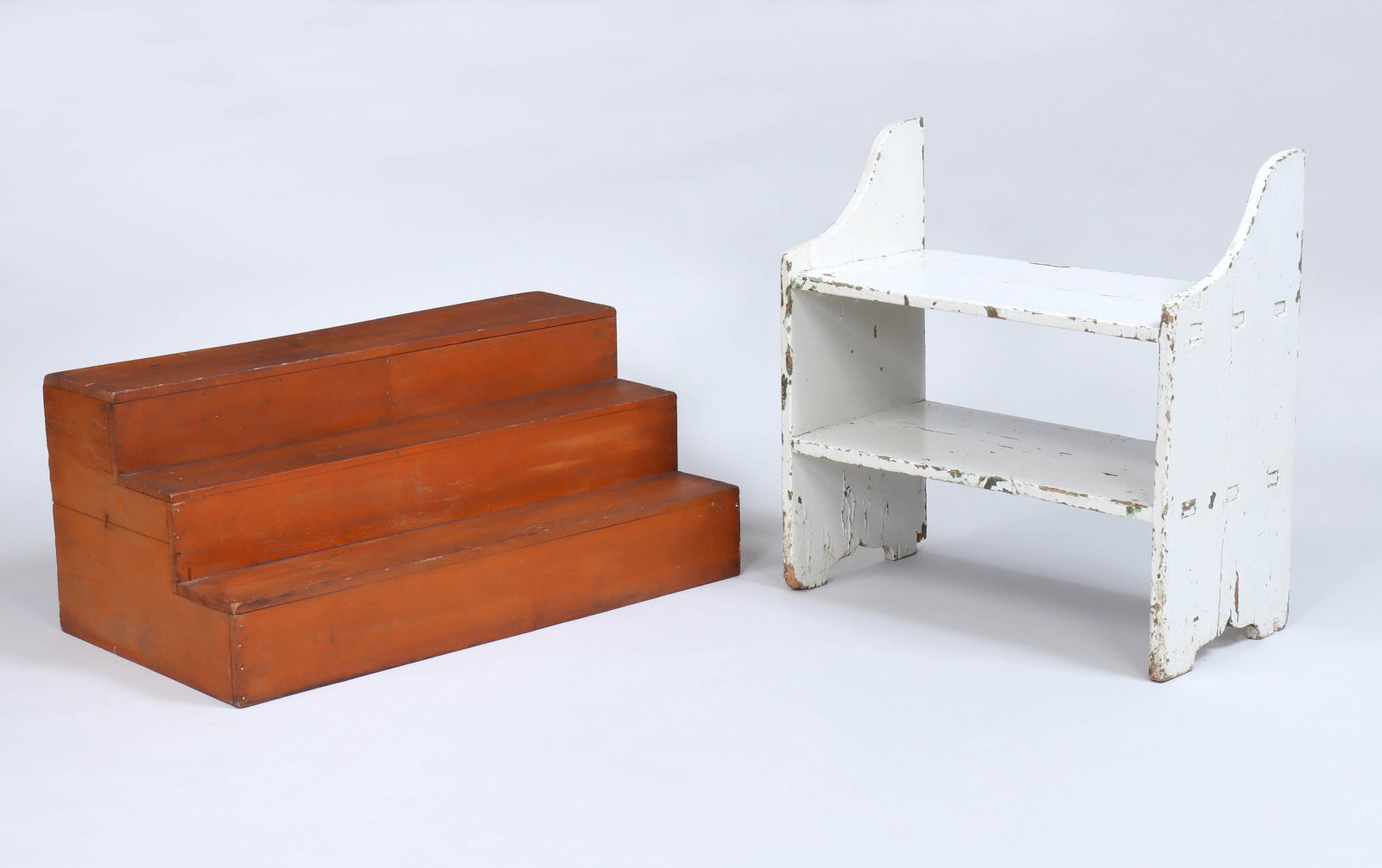 Group of (2) American Country Painted-wood Items: Group of (2) American Country Painted-wood Items to include: white-painted bucket bench; and three-level stepped display, orange-painted. Display 14 1/2 x 33 1/2 x 18 in. (36.8 x 85.1 x 45.7 cm.); Ben