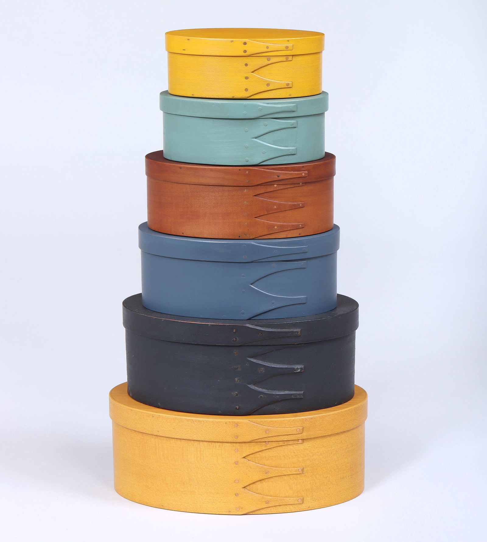 Group of (6) Contemporary Shaker and Shaker-Style Pantry Boxes: Group of (6) Contemporary Shaker and Shaker-Style Pantry Boxesof oval form with finger lap construction, painted or stained, 20th century, to include: (4) Hancock Shaker Village boxes, marked; box in