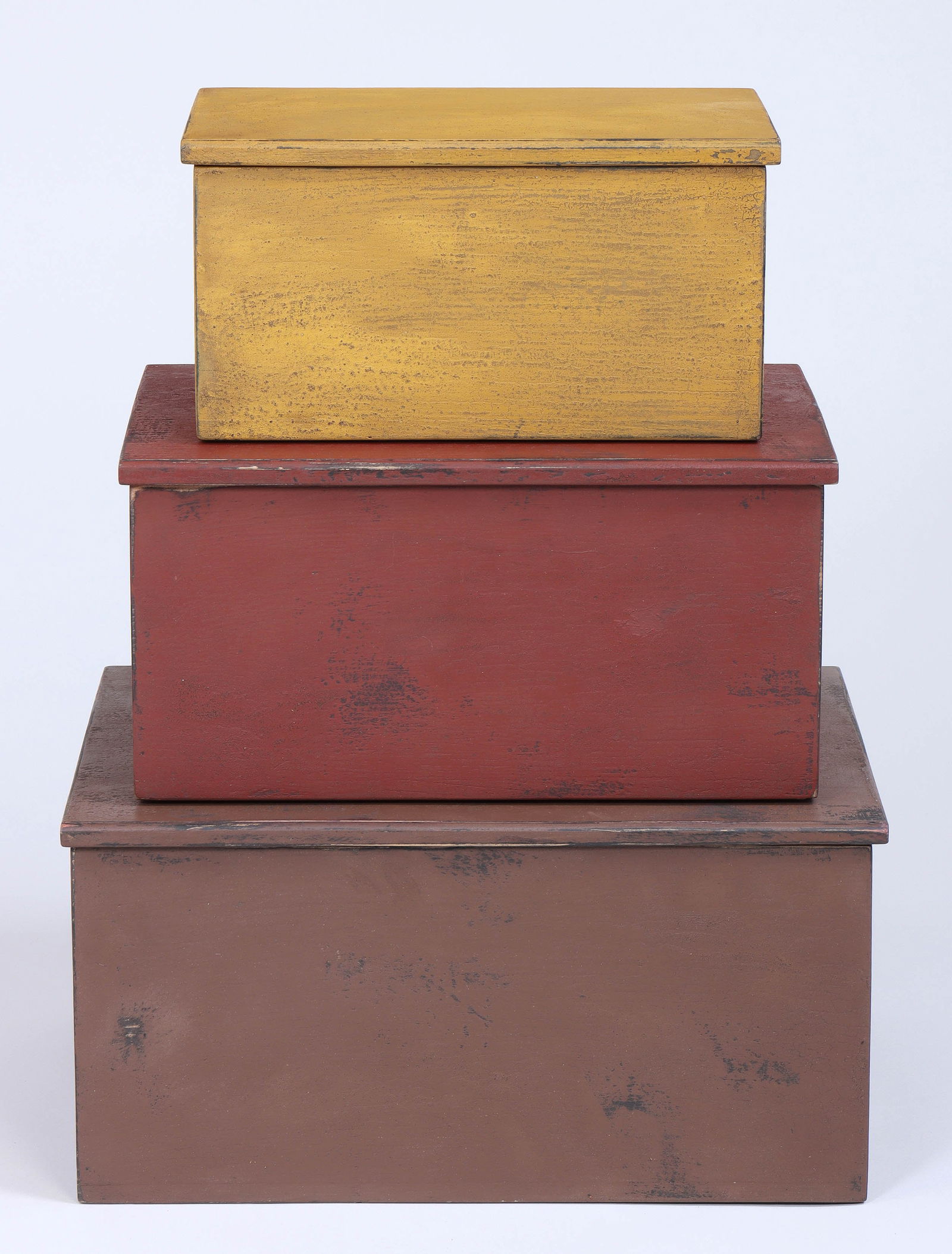 Group of (3) Contemporary Painted-wood Boxes: Group of (3) Contemporary Painted-wood Boxesin brown, red, and yellow distressed paint.Larger (brown) 9 1/4 x 18 1/2 x 14 1/4 in. (23.5 x 47 x 36.2 cm.) Provenance: Property of a South Shore, Long Isl