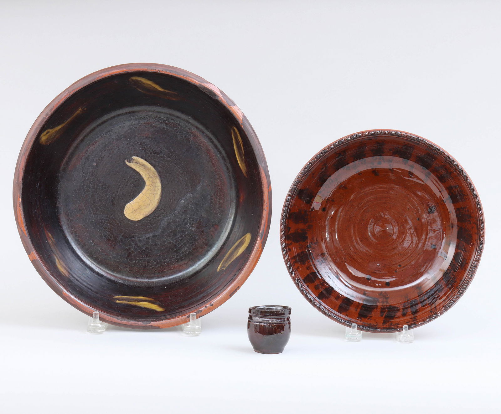 Group of (3) Contemporary American Redware Table Articles: Group of (3) Contemporary American Redware Table Articlesto include: bowl with slip decoration, in lead glaze, Greg Shooner, Massic Township, Warren County, Ohio, 1984, bottom with incised bird and fl