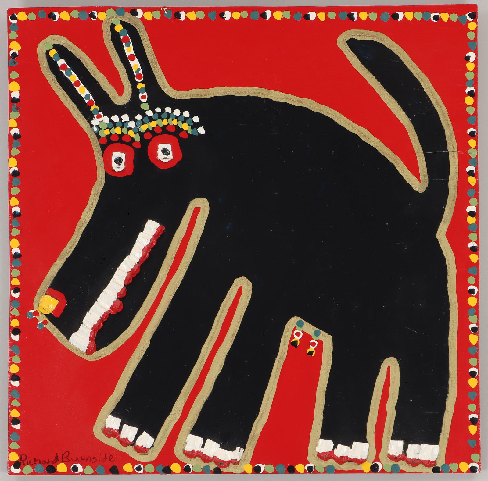 Richard Burnside (American 1944-2020), Black Dog on Red Background: Richard Burnside American, 1944-2020 Black Dog on Red Background enamel paint and pine cones on plywood panel signed lower left, Jimmy Hedges Rising Fawn Folk Art Gallery label adhered to verso. Panel