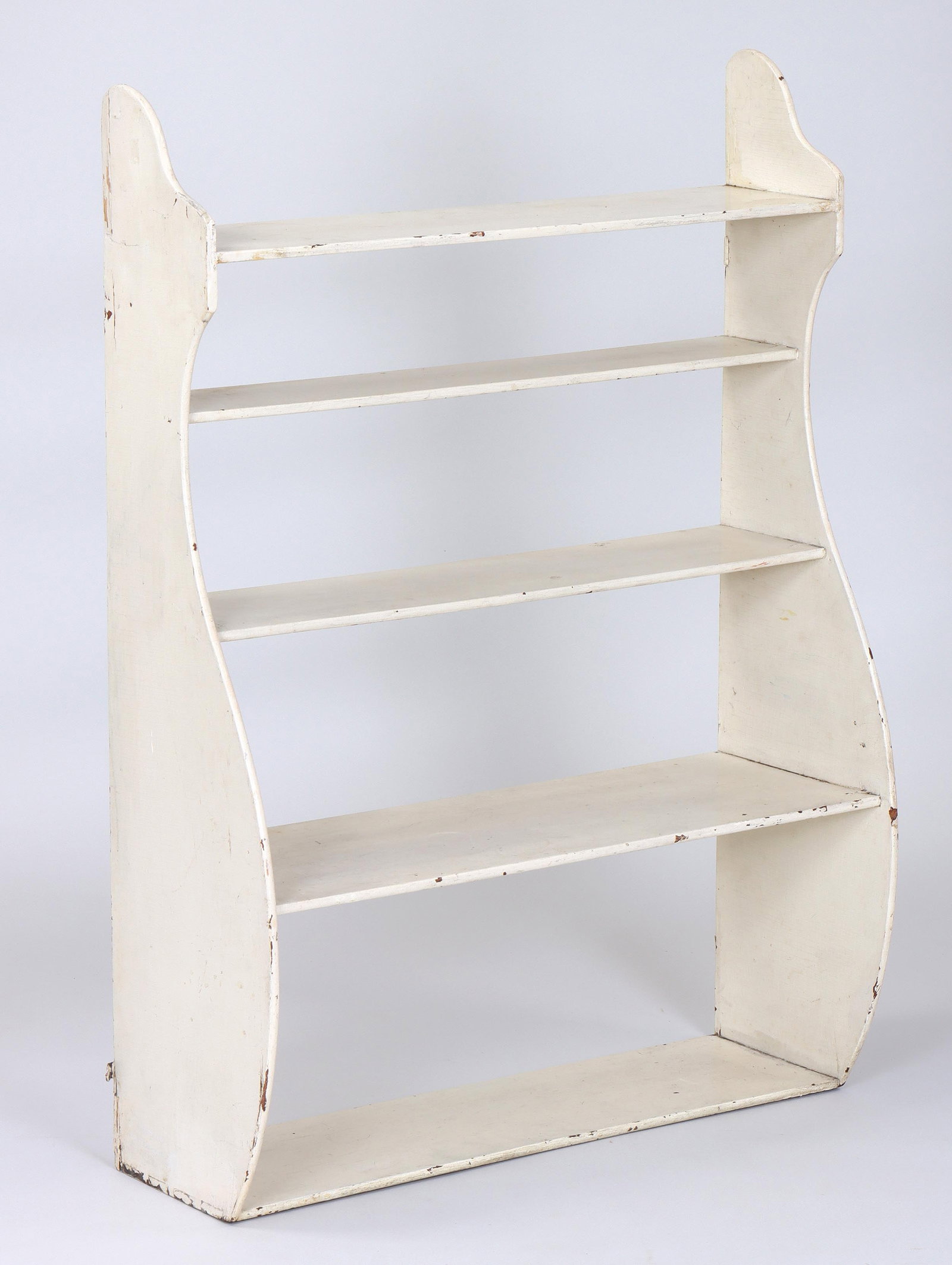 19th Century American Whale-end Wall Shelf: 19th Century American Whale-end Wall Shelf white-painted, with dovetail construction. 36 1/2 x 26 1/2 x 10 1/2 in. (92.7 x 67.3 x 26.7 cm.) Provenance: Property of a South Shore, Long Island collector