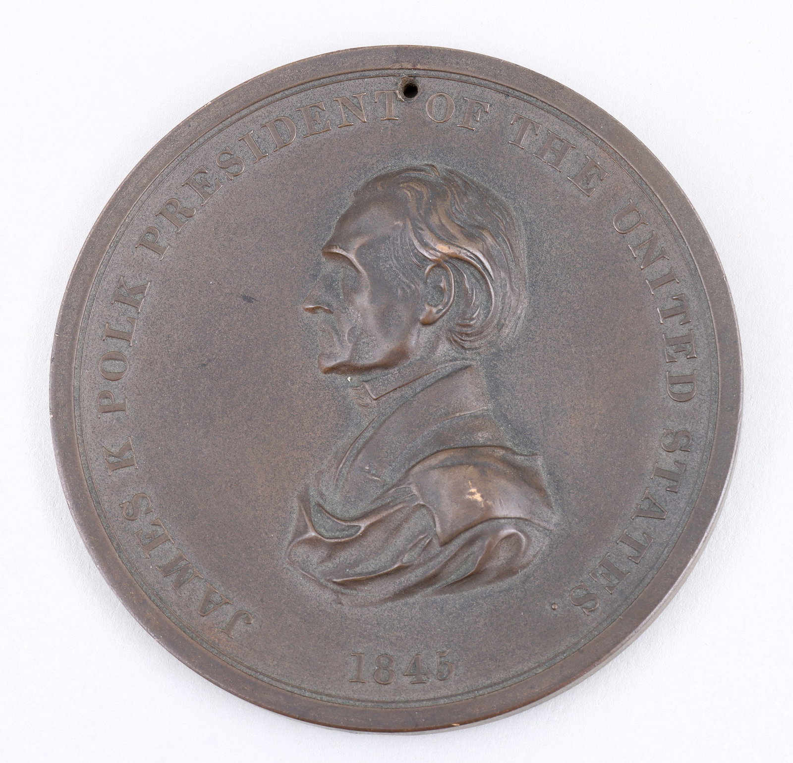 James K. Polk 1845 Peace Medal: James K. Polk 1845 Peace Medal cast bronze, front with draped bust portrait, embossed "James K. Polk President of the United States 1845", reverse with crossed tomahawk and pipe emblem over 